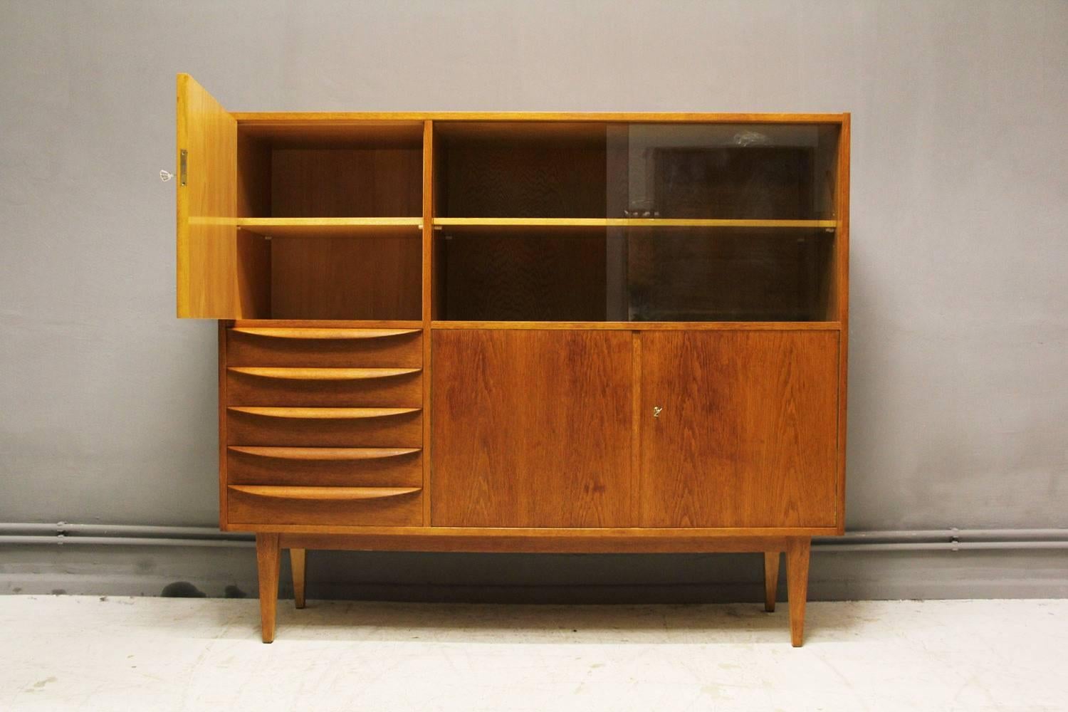 This Mid-Century Modern cabinet, model 