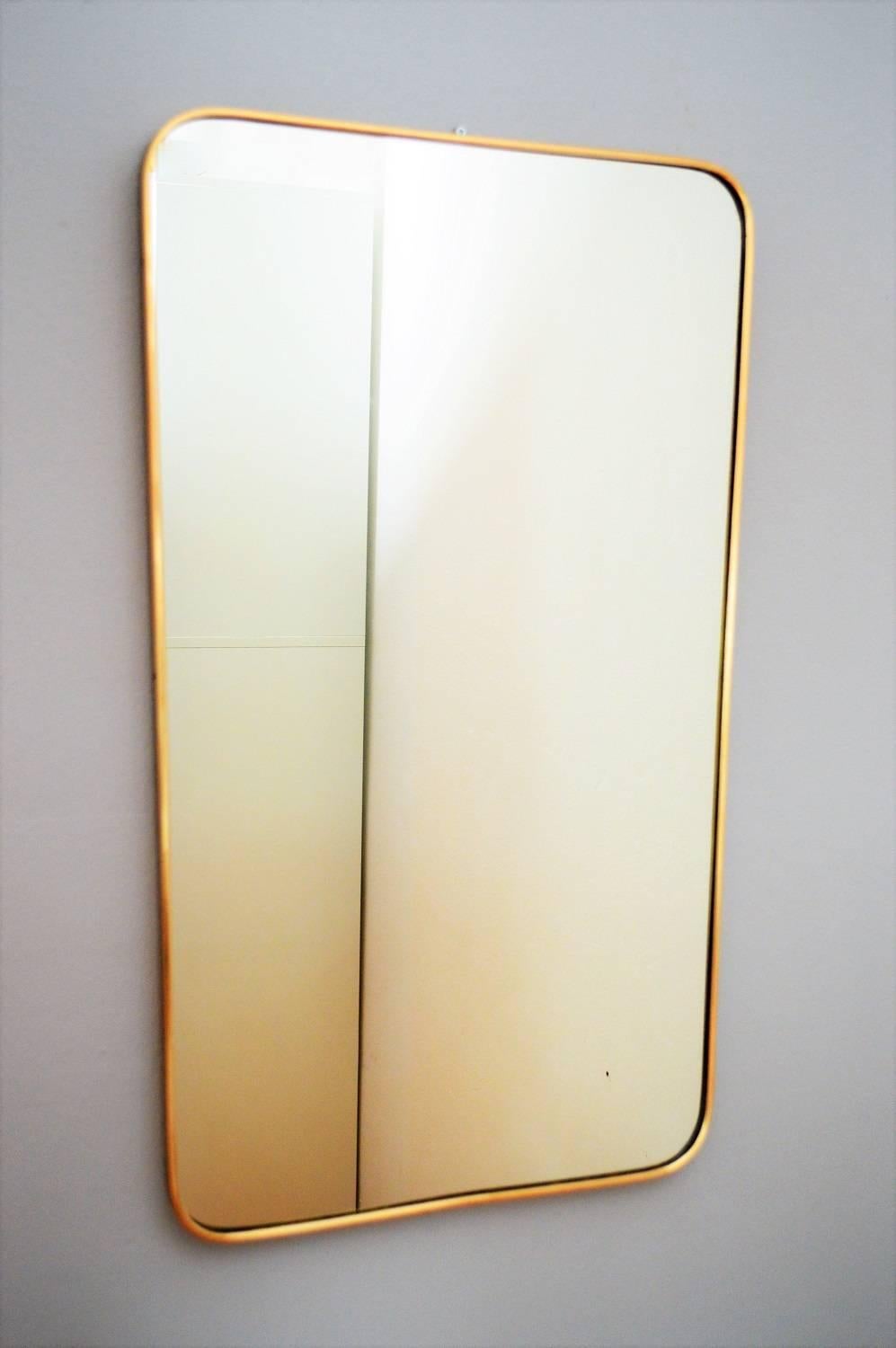 Beautiful big crystal glass wall mirror with brass frame, typical for the Italian Mid-Century Modern age.
Made in Italy from Sant'Ambrogio & De Berti in 1959. The original sticker is inside the mirror.
The mirror is in the original shape, the