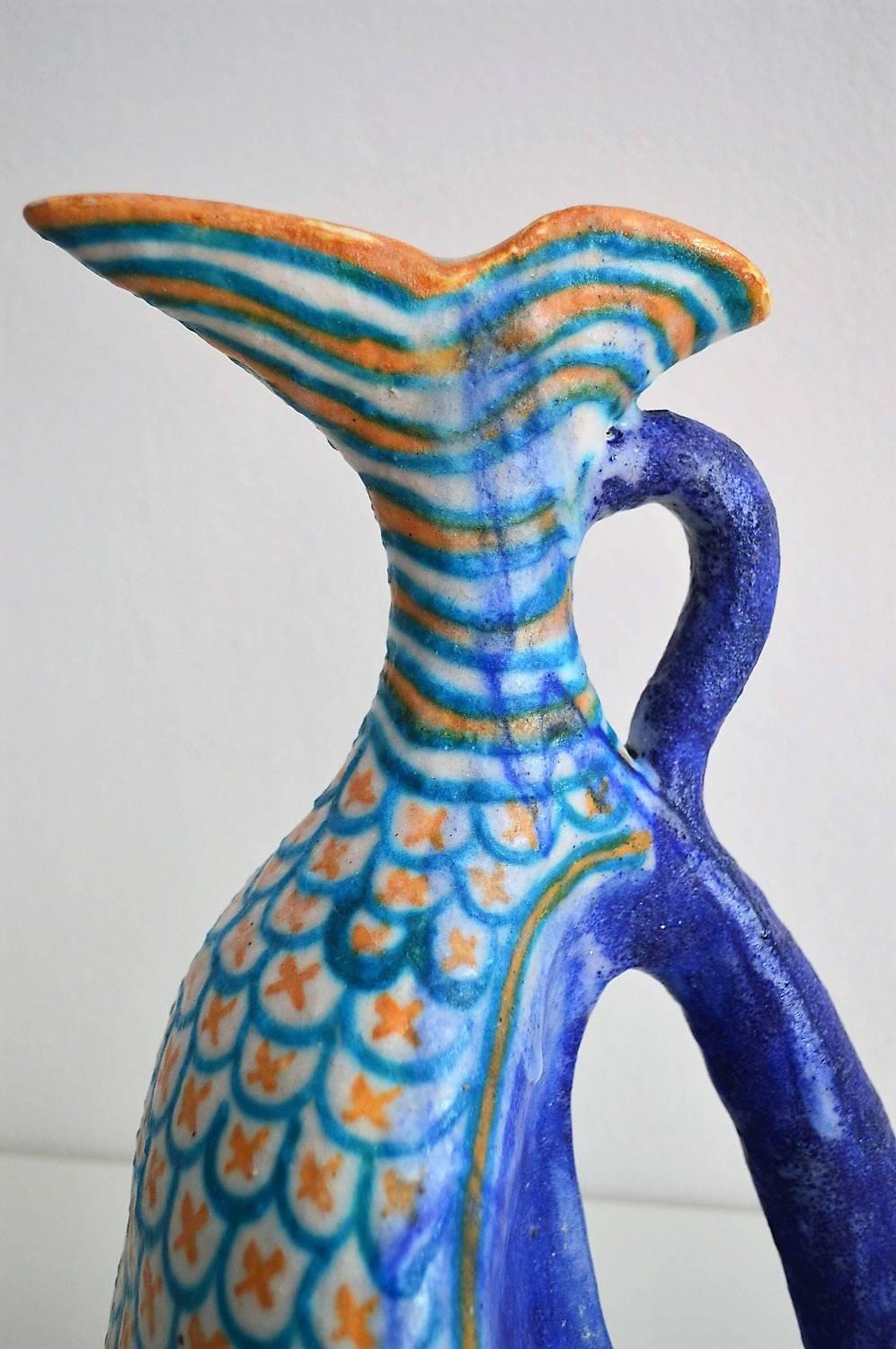 Beautiful, big and sophisticated ceramic vessel.
Handcrafted and decorated with gorgeous, multicolored shiny and intense glaze in different nuances. The thick glaze is partially worn and in some parts dripped down (wanted). 
This piece is done in