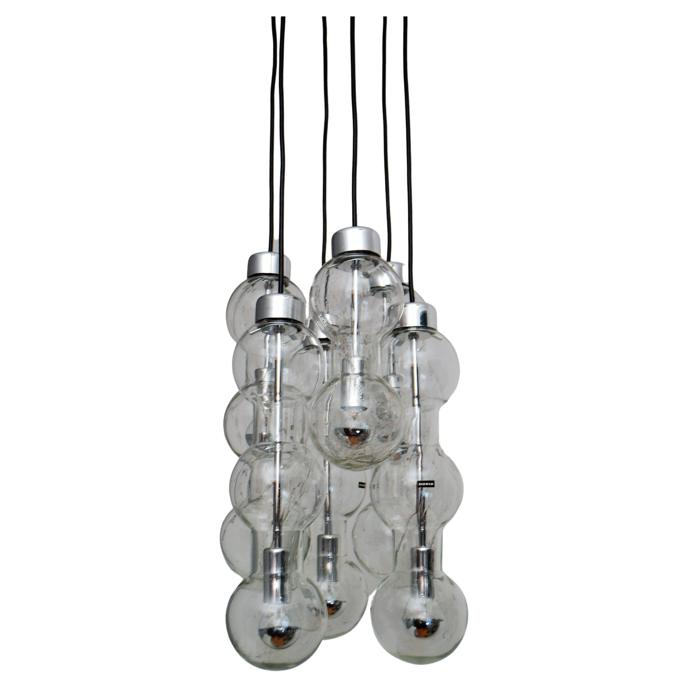 Beautiful and rare late 20th century cascade chandelier with six ice bubble glass tubes of different length
Made from Doria, Germany, beginning of the 1980s.
High quality
This beautiful cascade hanging lamp have been produced in small quantities is