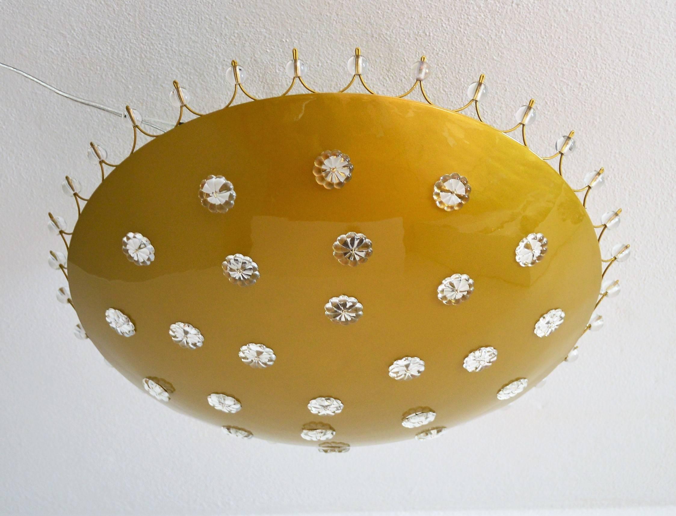 A stunning midcentury flush mount lighting or ceiling lamp designed by Emil Stejnar in the 1950s for Rupert Nikoll, Vienna, Austria.
Made of a dome-shaped metal base with transparent glass flowers and glass pearls around the ceiling crown.
When