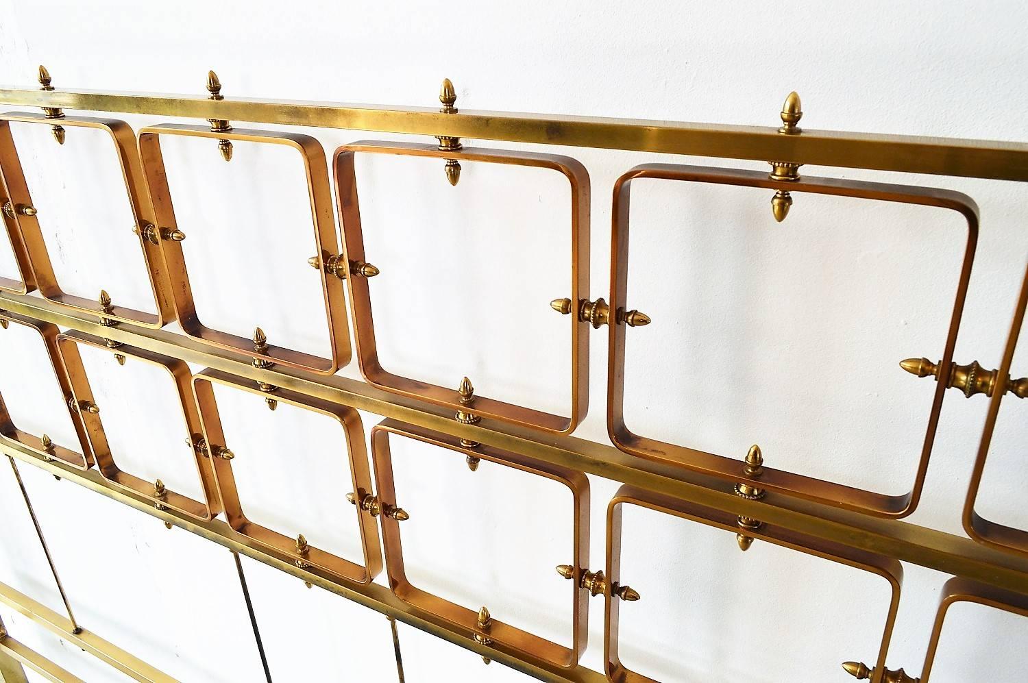 Elegant sculptural Italian Mid-Century Modern bed frame made of full, shiny brass with fantastic patina.
The headboard and footboard, composed of countless details are made of solid shiny brass.
The parts which are hidden under the mattress are