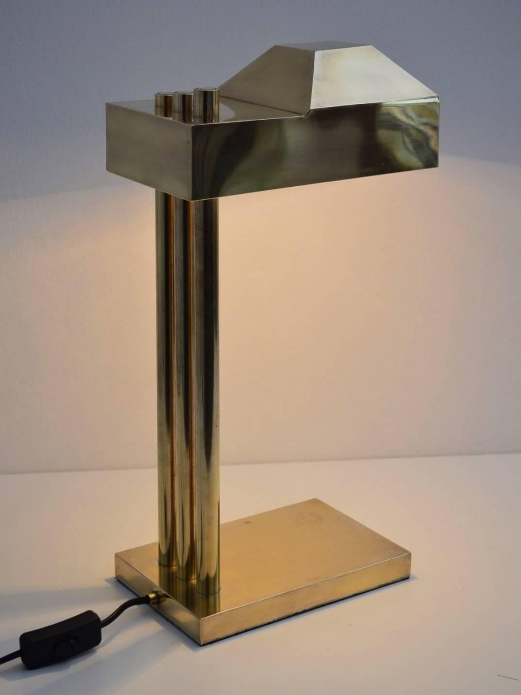 Beautiful shiny brass desk or table lamp designed by Marcel Breuer and manufactured before 1925 to be exposed during the exhibition in Paris 1925. The marking stamp confirms place and date. (see picture)
A real treasure with stunning modern design