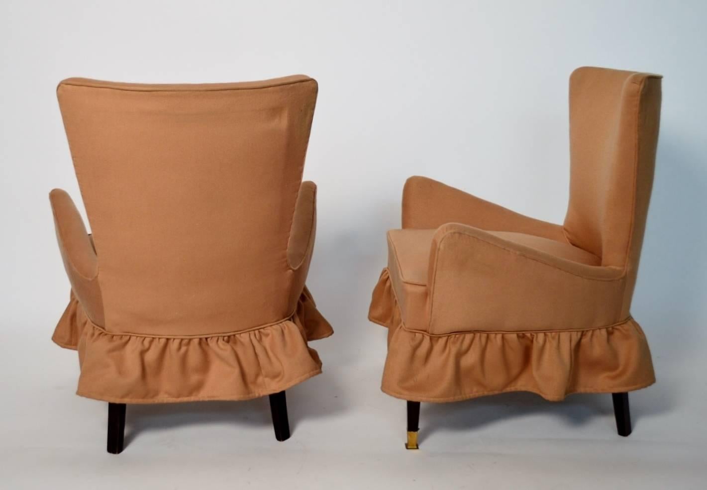Set of two very particular and feminine Italian small armchairs or slipper chairs with square mahogany feet and brass details, in very good original condition.
Usually this form and size of chairs have been used in the bedroom and served as clothes
