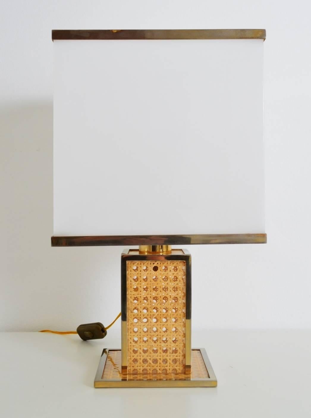 Beautiful table lamp in the style of Romeo Rega composed of a brass and Lucite base with wicker / cane inserts and acrylic/brass lampshade.
All brass details are with fantastic patina.
The lamp have been checked and cleaned, full function, ready