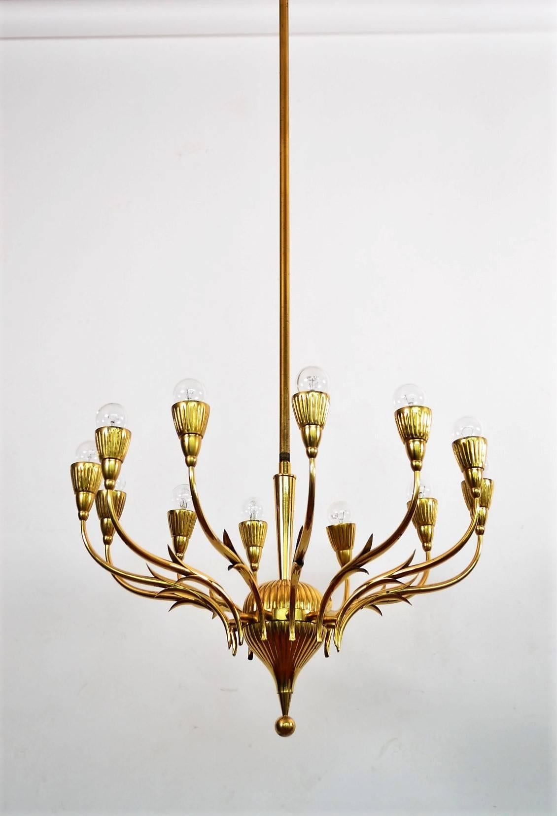 Gorgeous and elegant mid-century full brass chandelier with extra long original center rod, suitable for rooms with high ceiling, entrance hall or staircase.
Made in Italy, 1950s.
The chandelier is equipped with twelve small bulb holders for