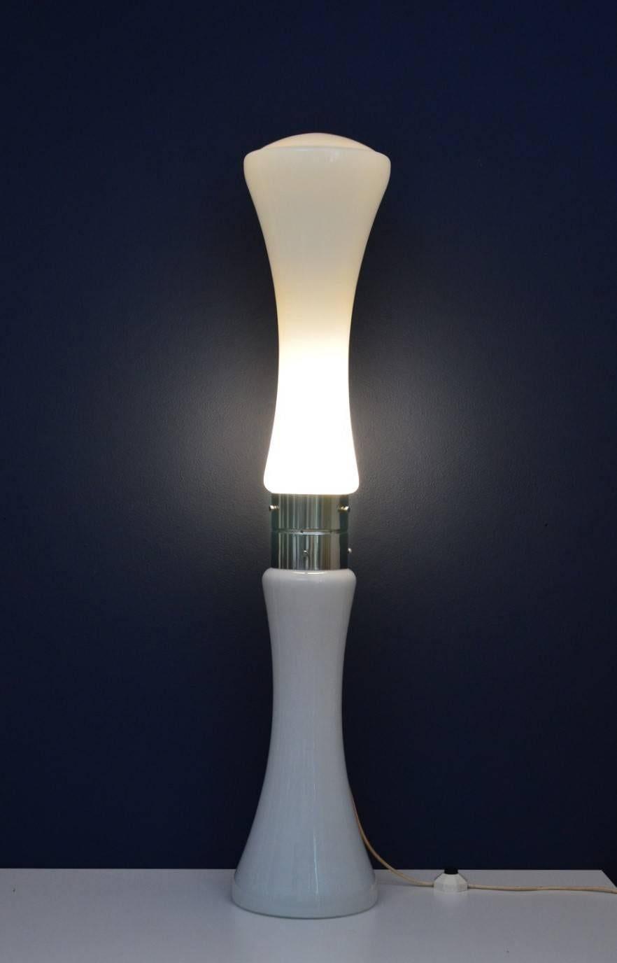 High sculptural illuminated floor lamp in the style of Carlo Nason.
Made of two main Murano made glass bodies and a chromium plated metal part in the middle of the glasses, where are placed the bulbs inside and fixed the wire.
The lamp could be
