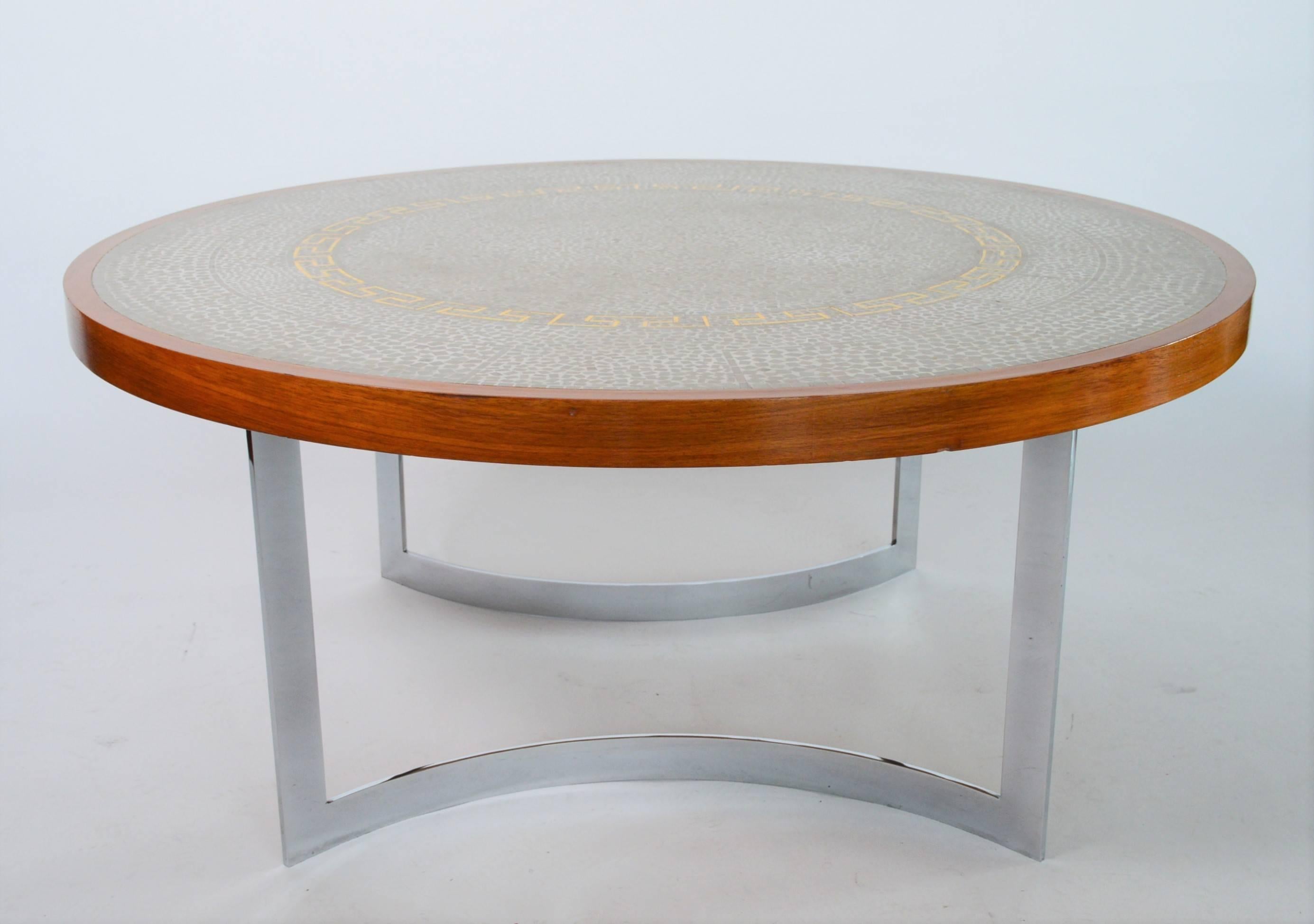 Beautiful midcentury coffee table with a round mosaic tile top, wooden table frame (made of clear walnut) and two curved, chromed and strong legs.
Designed and made by Berthold Müller, Germany, in 1966 (please see label under the table).
The