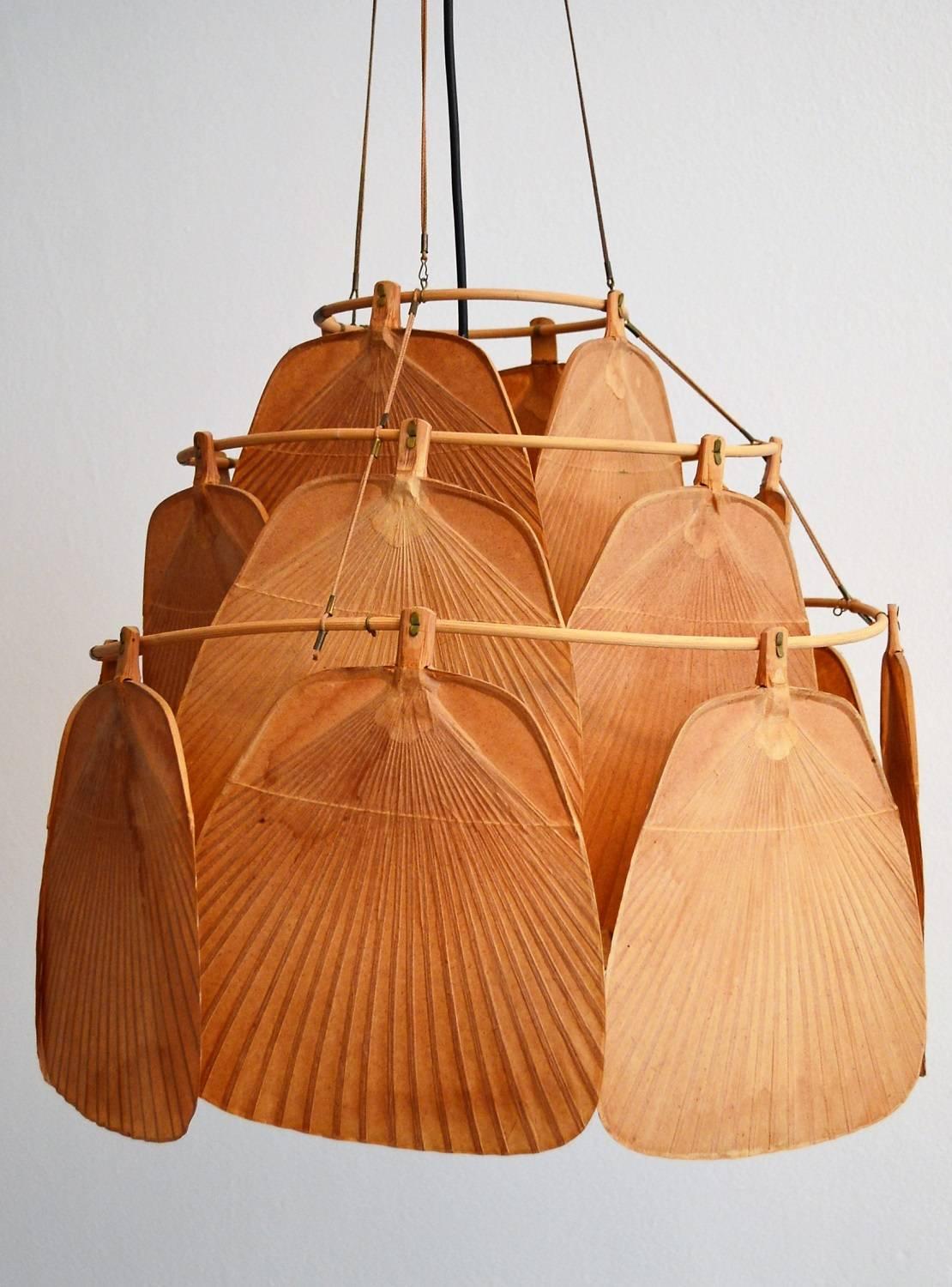 Beautiful and rare lamp named Ju-Ku made of 19 delicate fans which are made of bamboo and rice paper and divided on three tiers.
Designed from Ingo Maurer, circa 1973.
The fans are attached with clamps to a bamboo frame, all clamps are in very