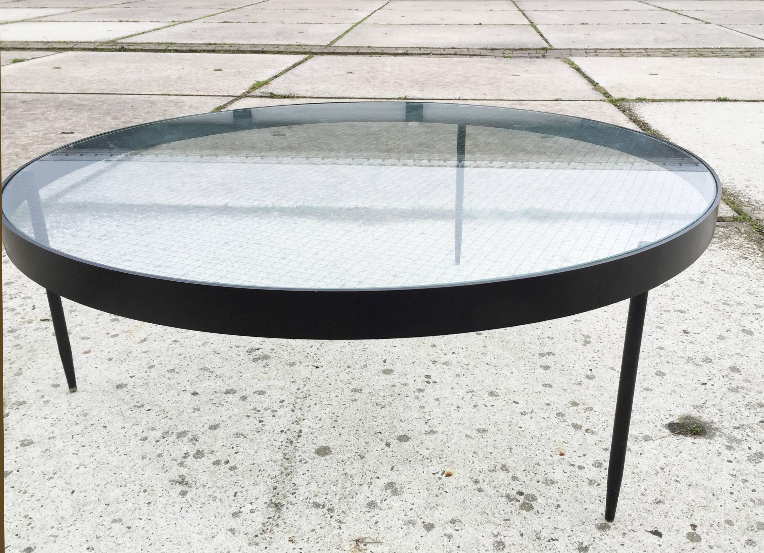 This extraordinary elegant coffee table was designed by Janni van Pelt and produced upon request by Bas van Pelt in the late fifties. The table is in excellent vintage condition with original wire glass top. This very rare piece is timeless and