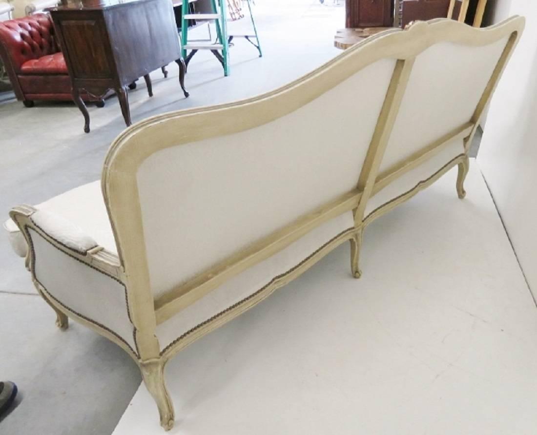Cream painted frame with gilt highlights. Cream sateen leopard style upholstery.