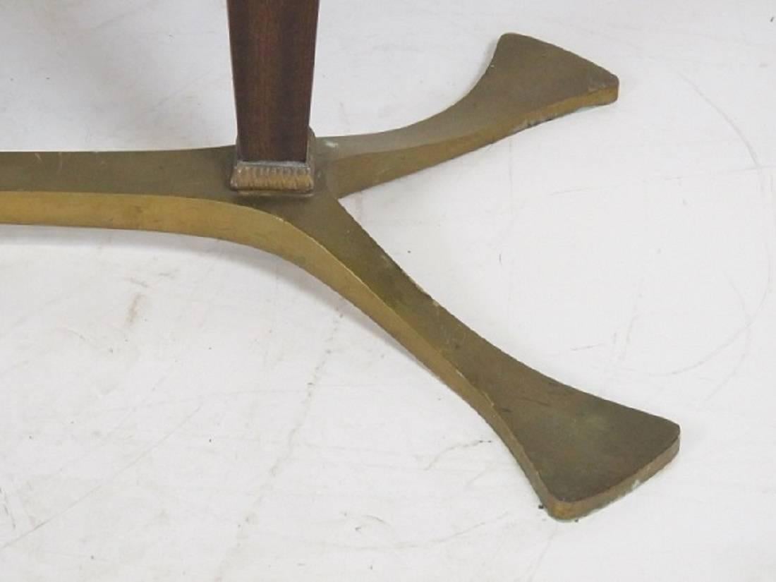 Italian modern oval mahogany dining table. Mahogany with metal feet.