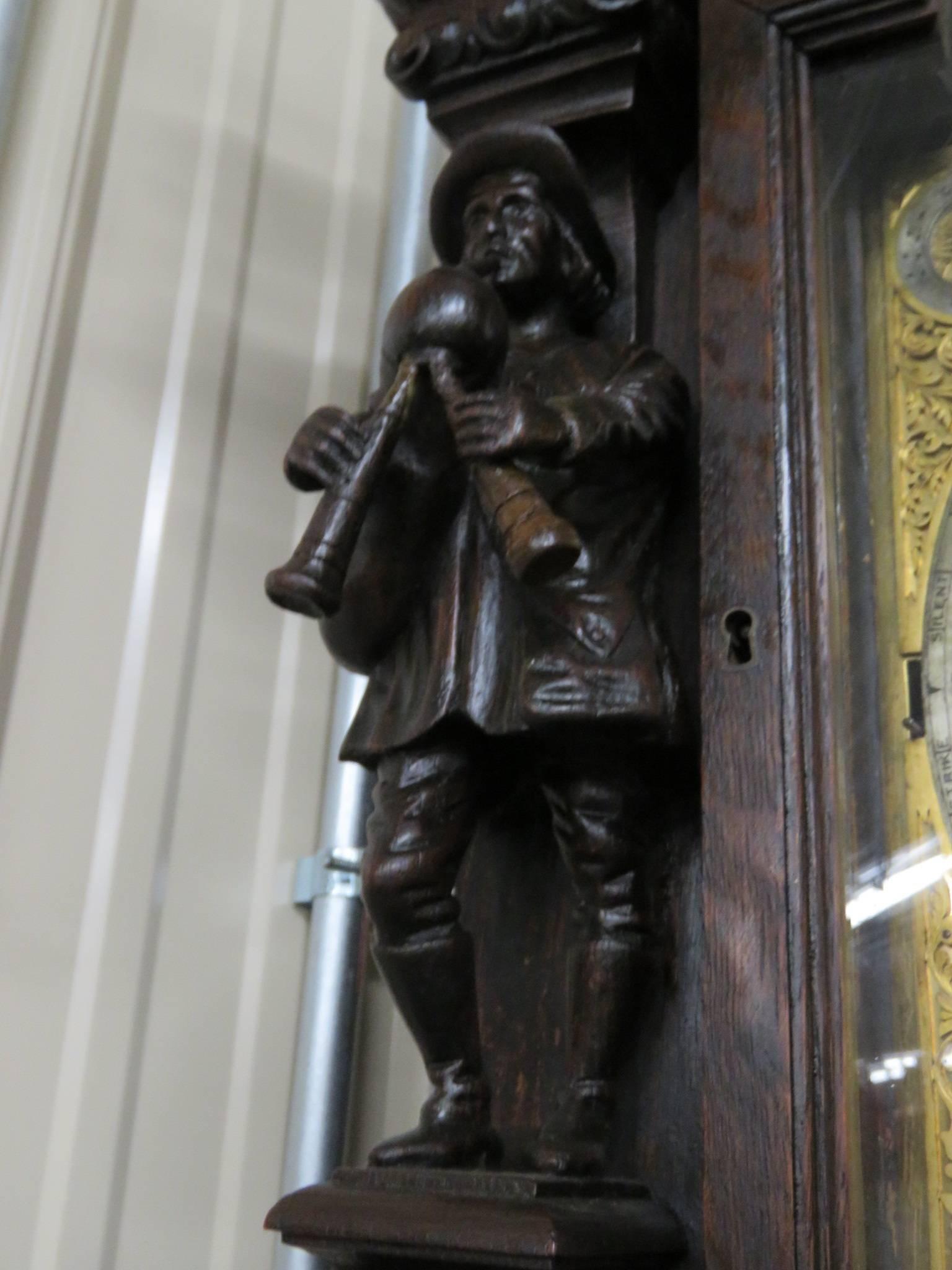 Beautiful Antique Elliot of London nine tubed oak clock with an Elliot movement by Tobey. Black Starr & Frost with intricately carved figures w/ a sun and moon dial.