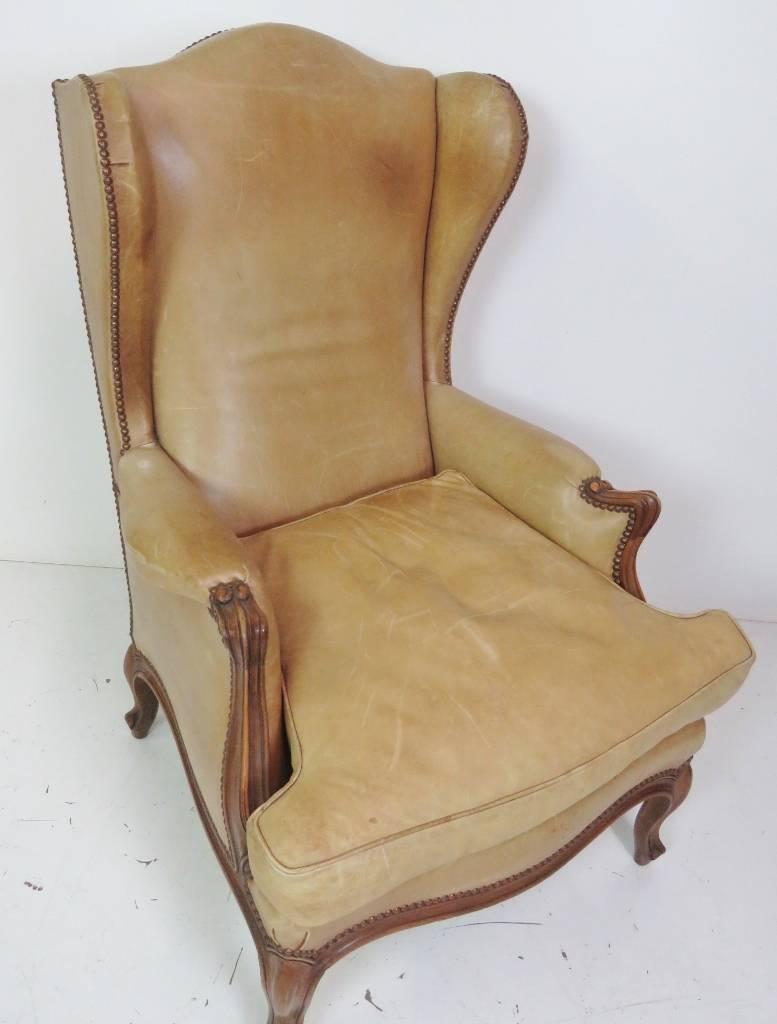 Louis XVI style leather wing chair. Leather upholstery.