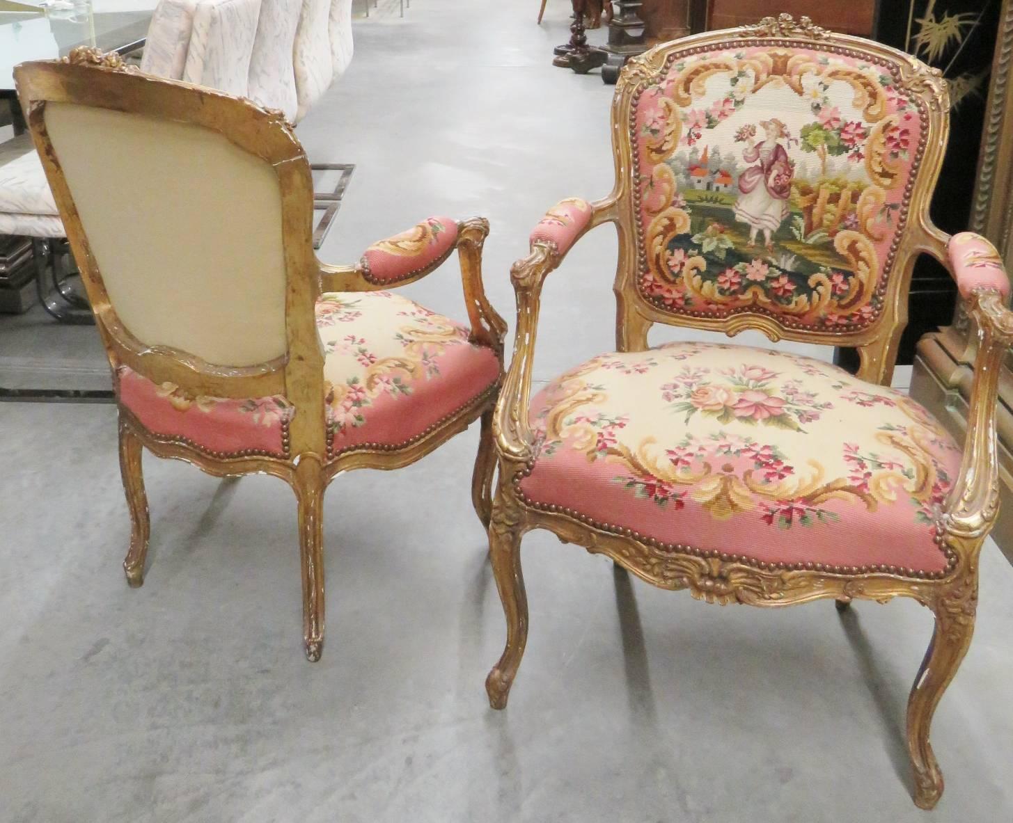 Pair of Louis XVI style gilt painted Aubusson fauteuils. Courting scenes. Painted gilt frames.
