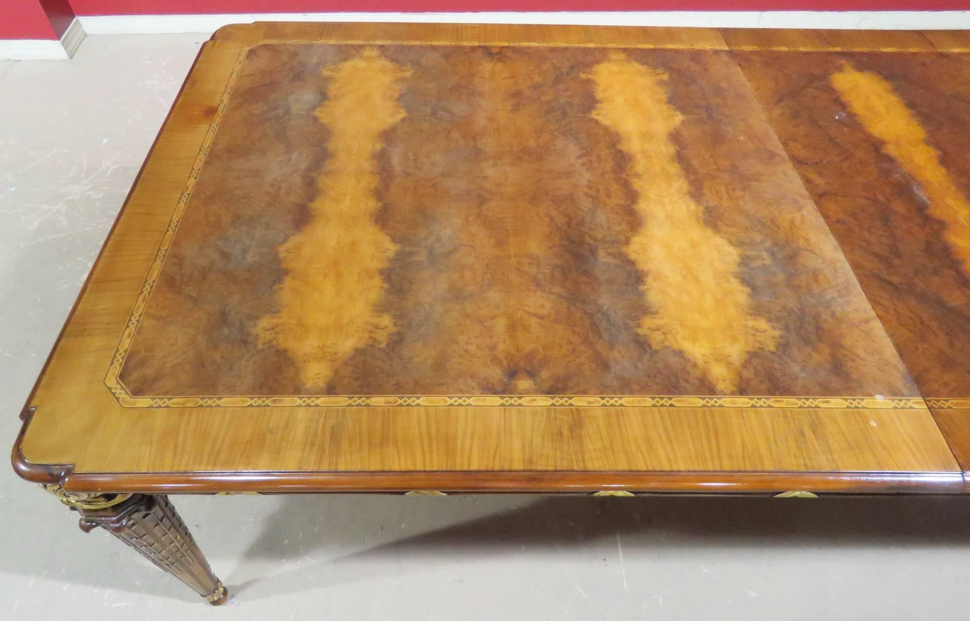 Burl walnut with walnut banded top. Gilt highlights.