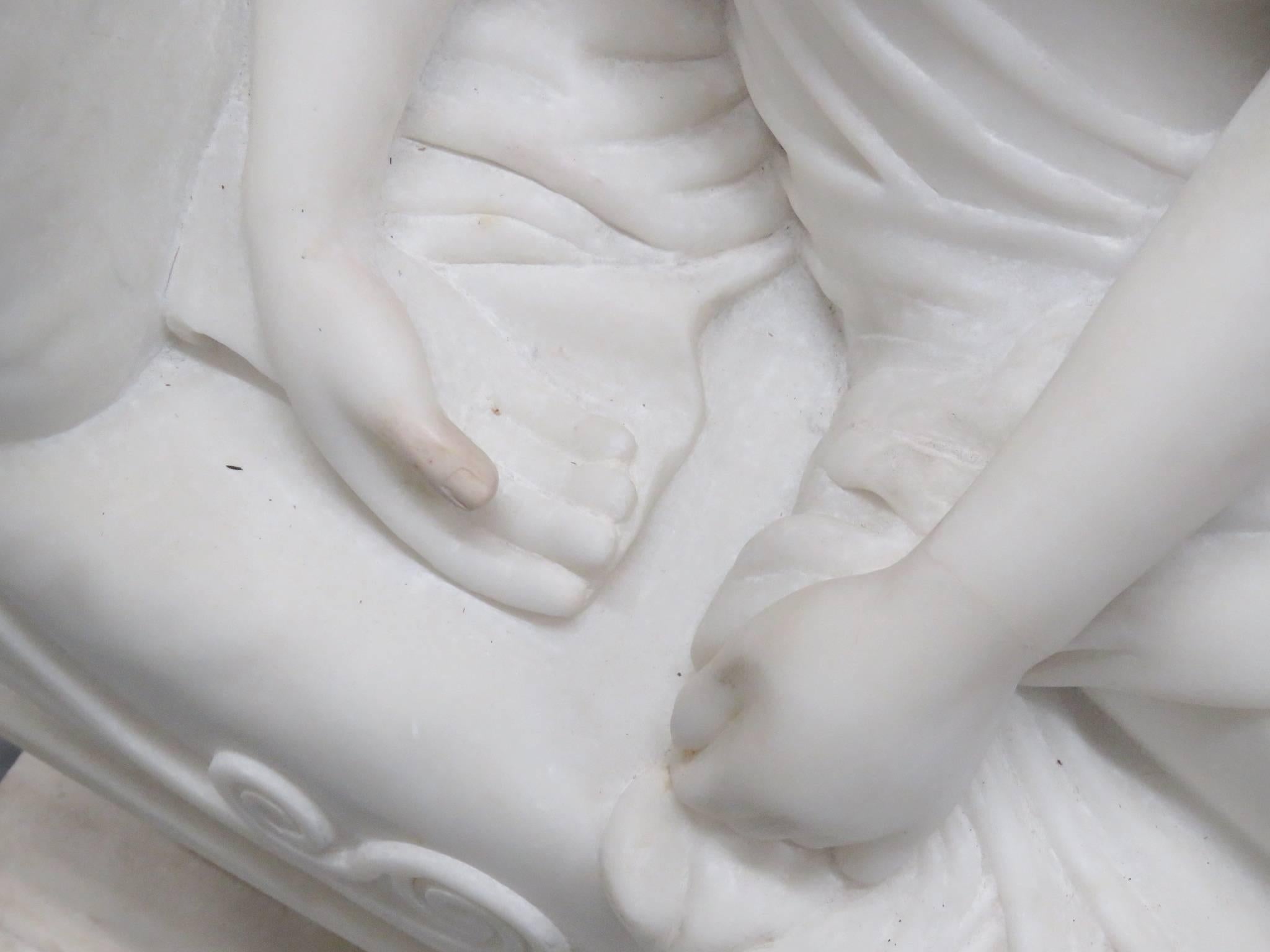 This is a gorgeous and very large, superbly carved Carrara marble statue of a lounging Lady. The way she is dressed is of the period she was made in. She lay there in beautiful repose. I can only imagine the delight of the original owner and the