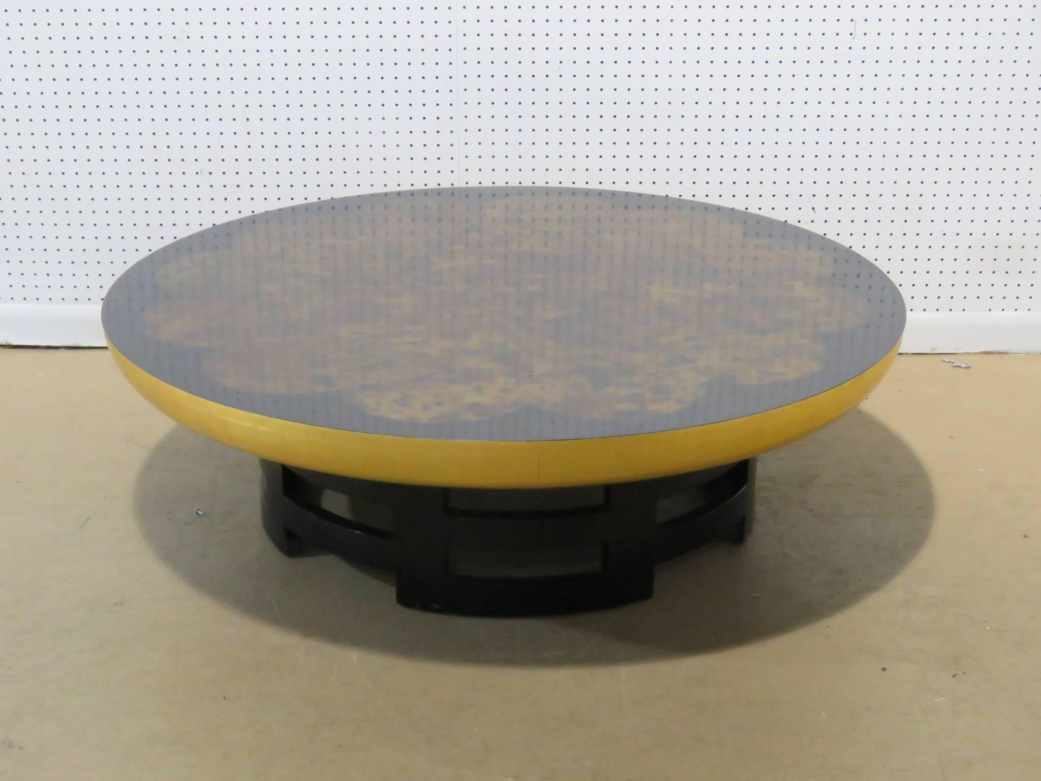 Theodore Muller Kittinger coffee table. Ebonized base with burl walnut floral top.