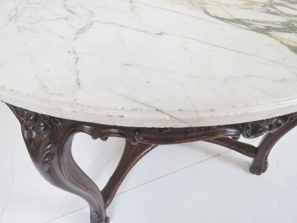 White marble-top with carved rosewood base.