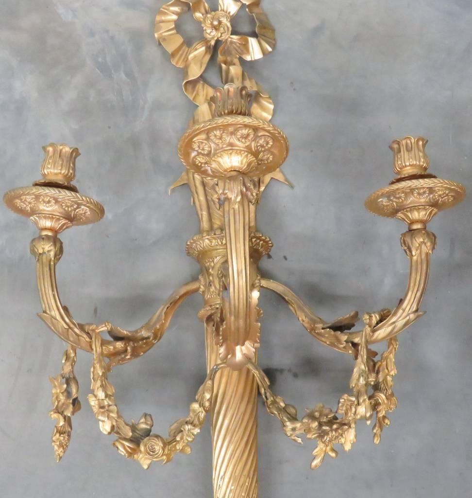 Superb quality bronze that's been hand-chased for a crisp finish. These sconces are shown in the movie Titanic. They are very large and heavy and of the finest possible quality. These sconces are far better looking and larger in person than they