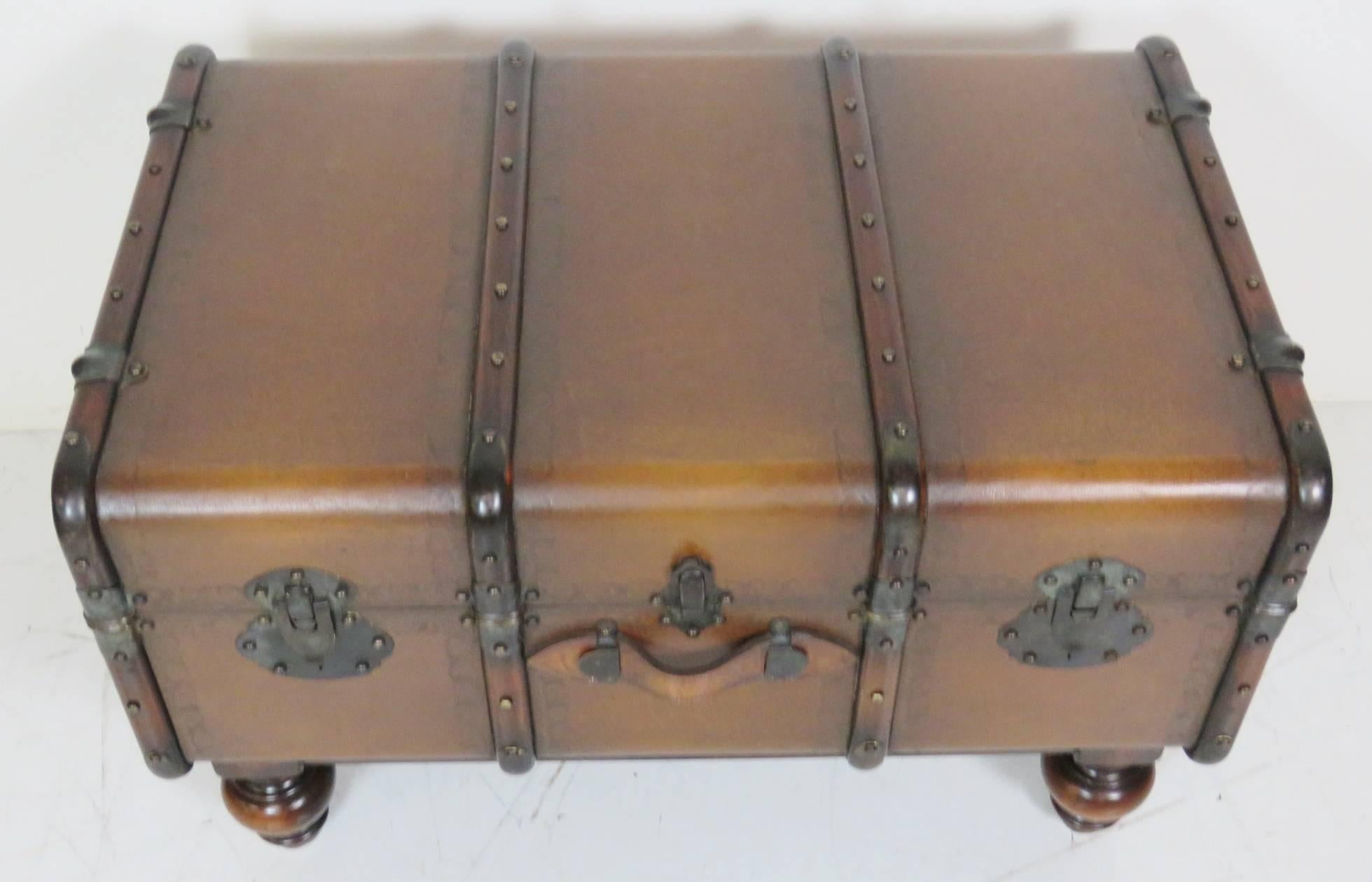 Leather trunk with metal hardware.