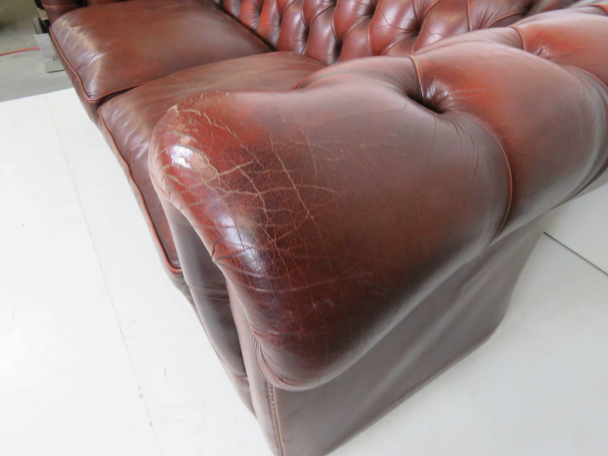 Distressed brown tufted leather.