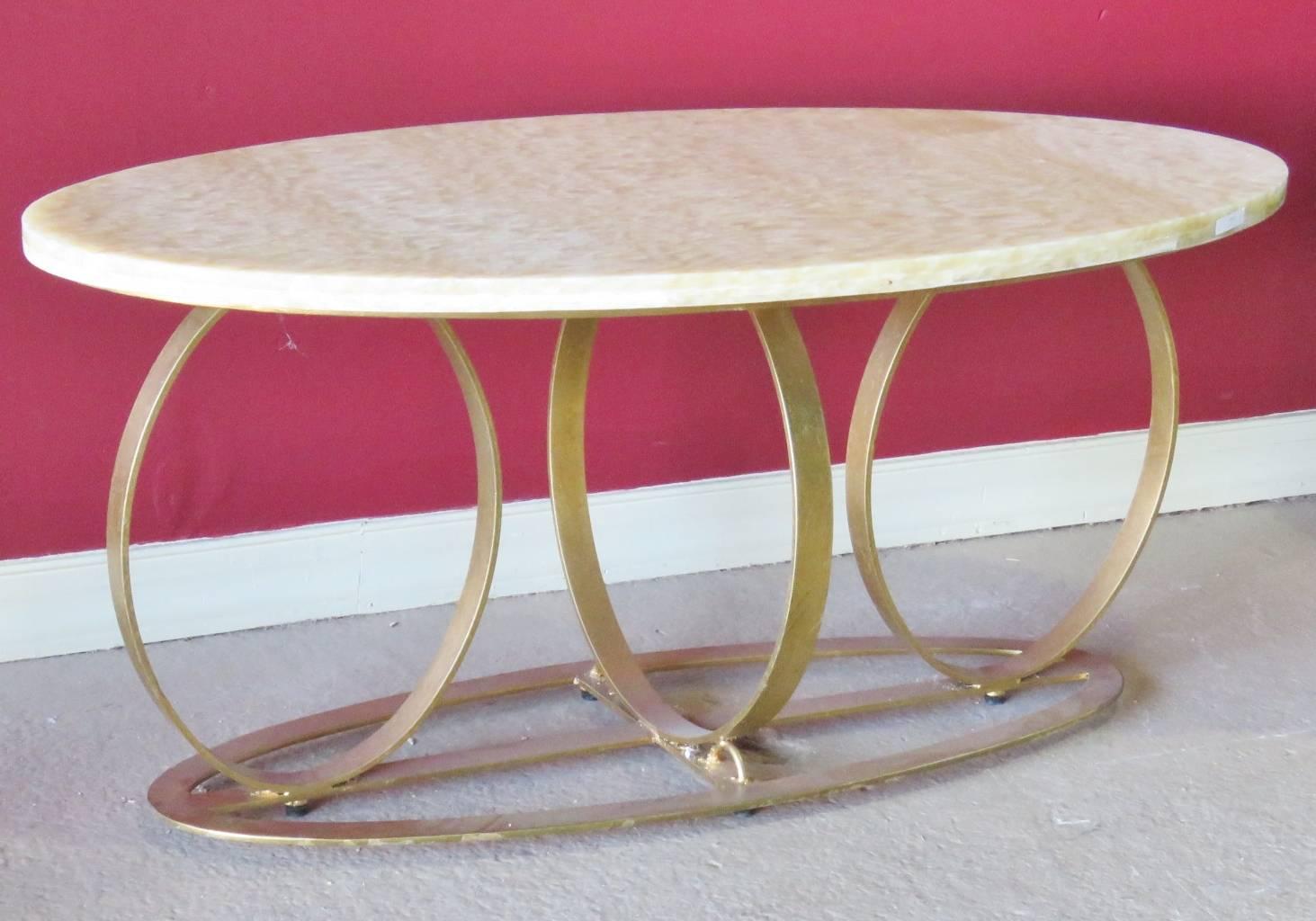 Oval marble top. Gilt painted metal base.