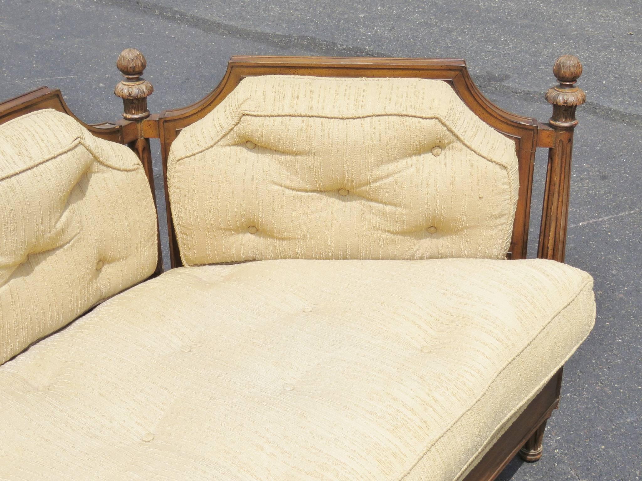 Carved walnut frame. Cream tufted upholstery.