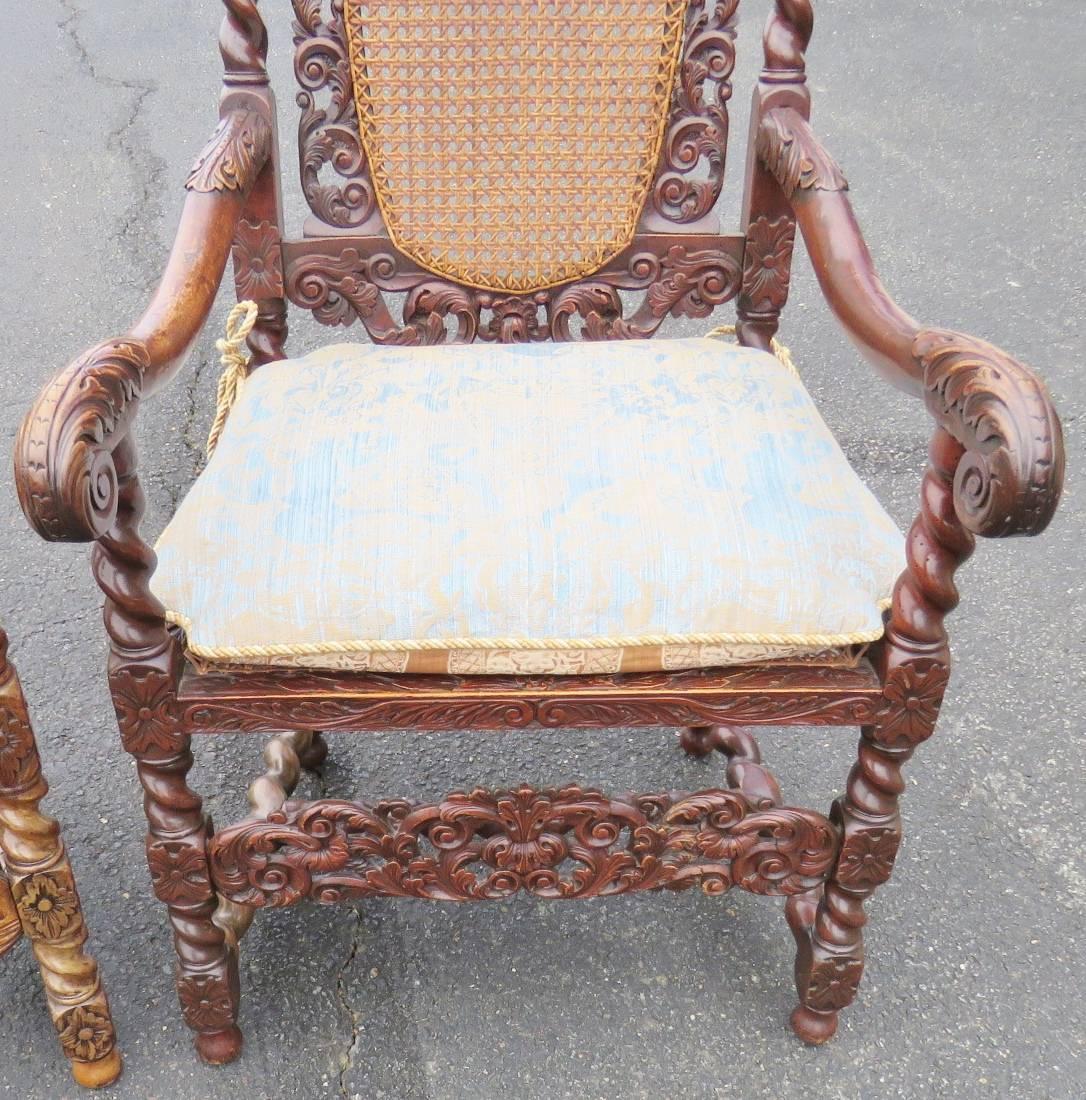 Carved walnut barley twist frames. Caned back and seat. Floral upholstered cushion. Pegged frame.