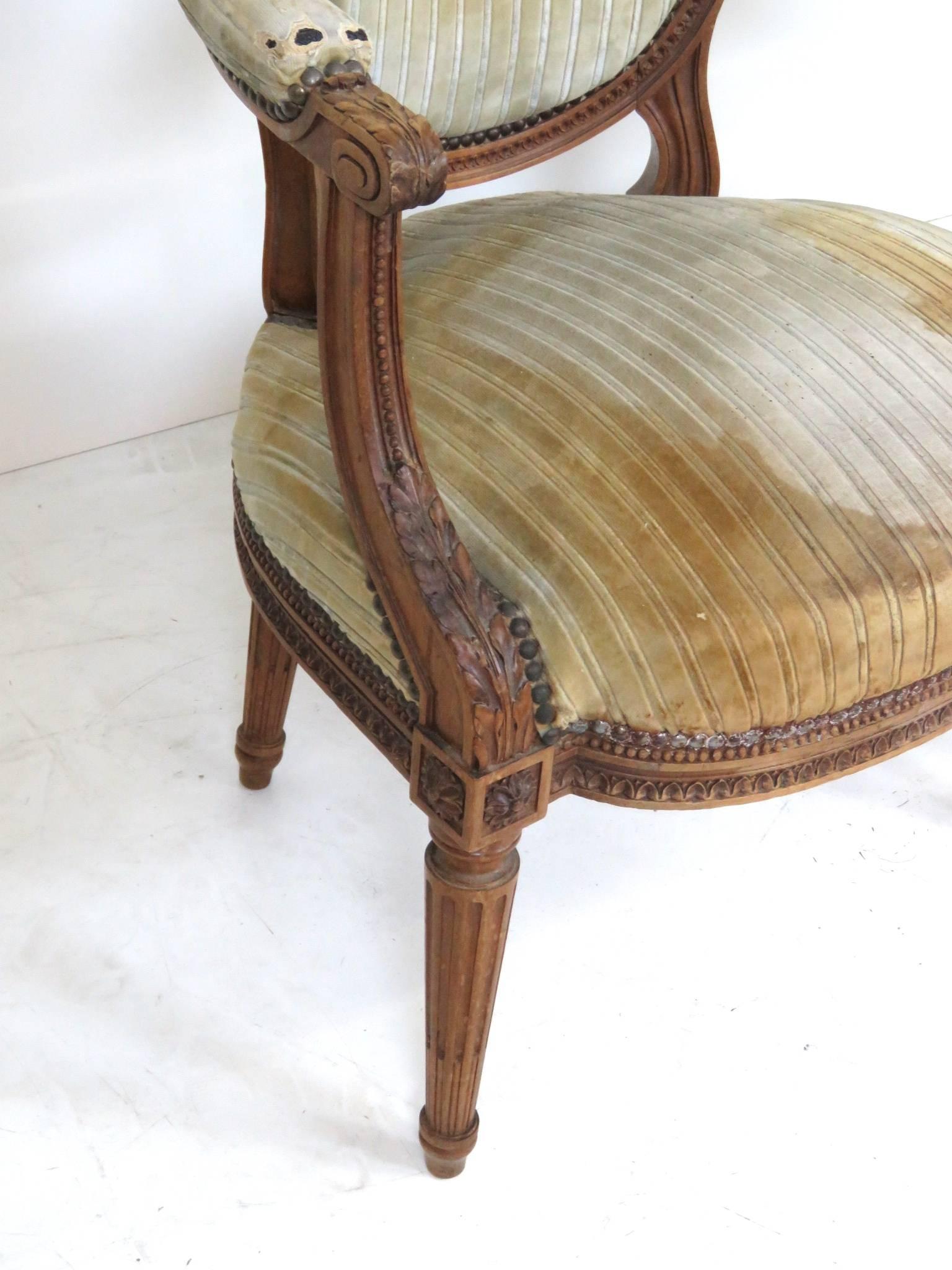 Fruitwood Pair of Antique Louis XVI Style Carved Walnut Fauteuils Arm Chairs For Sale