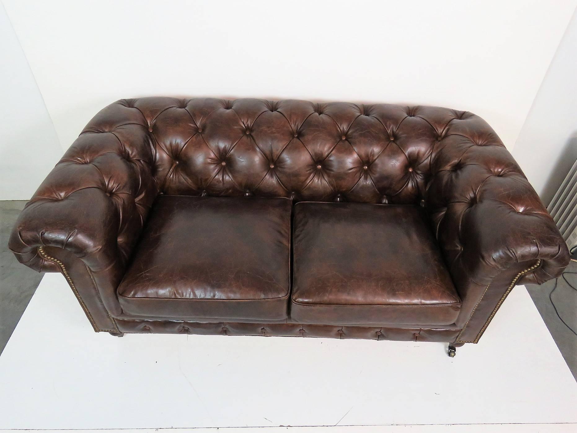 Distressed brown tufted leather.