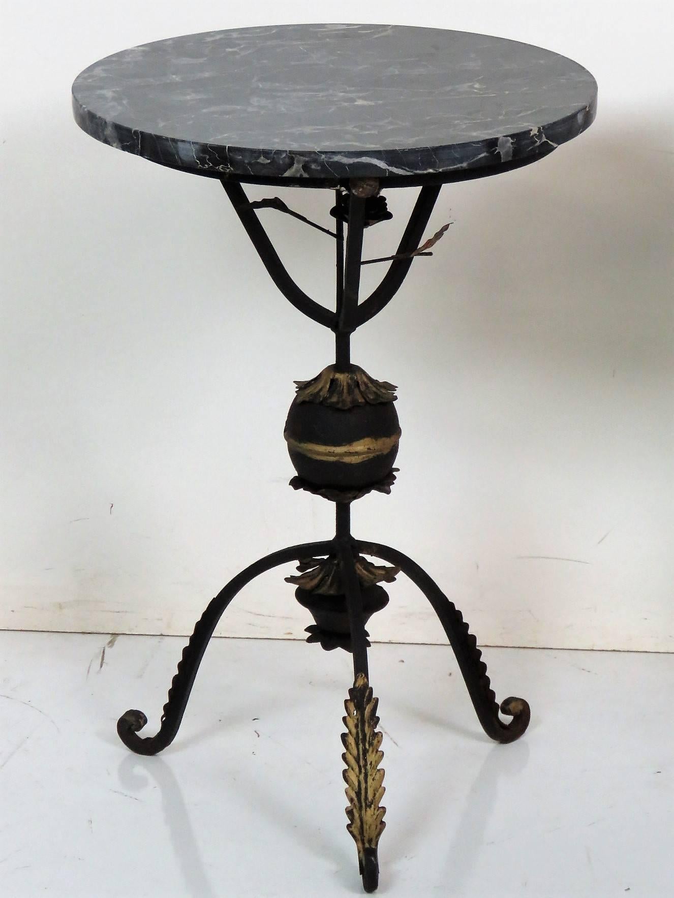 Black wrought iron bases with gilt highlights. Marble tops.