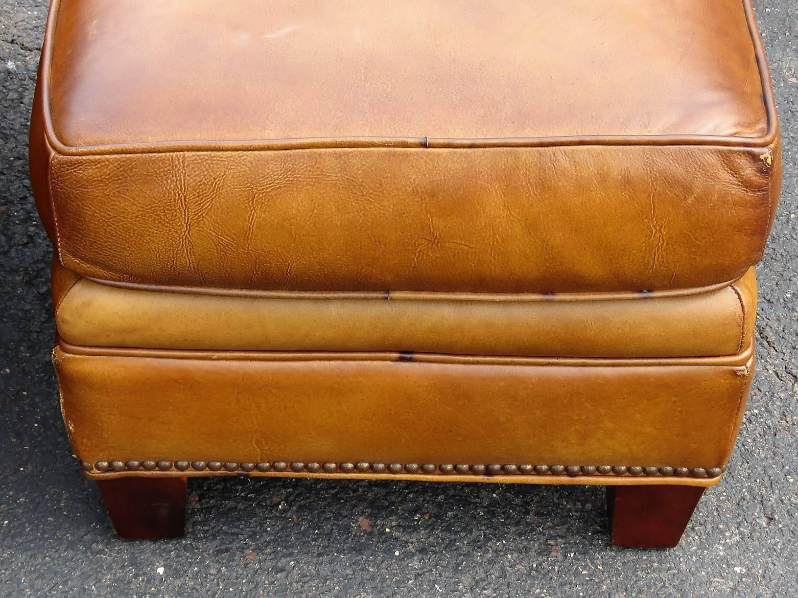 distressed brown leather ottoman