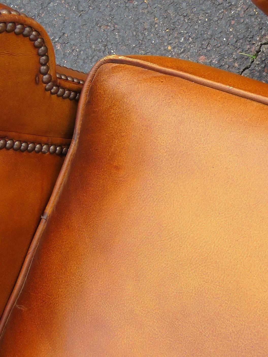 20th Century Distressed Brown Leather Lounge Chair and Ottoman