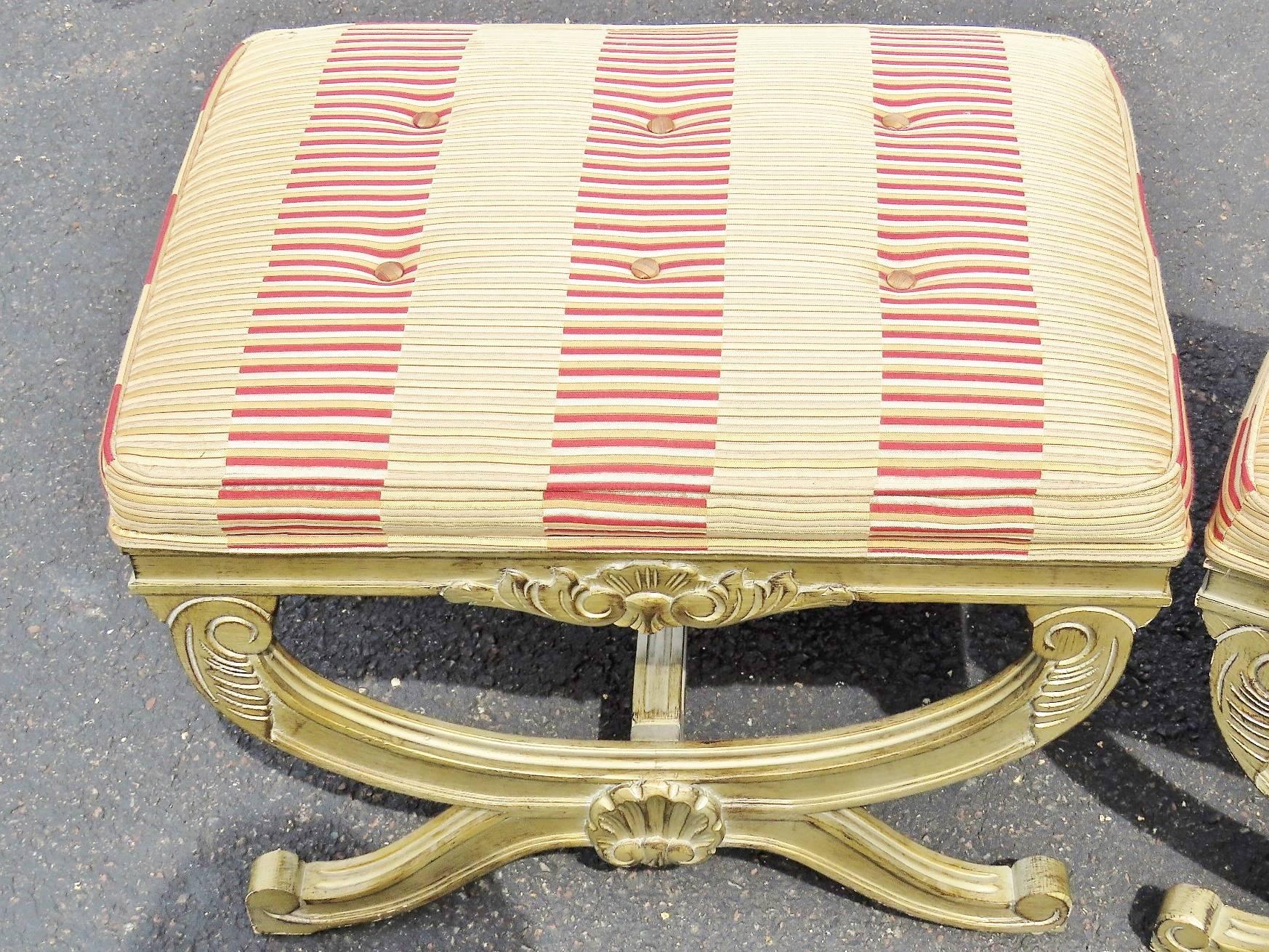 Distressed cream painted frames with shell motifs. Red and cream striped upholstery.