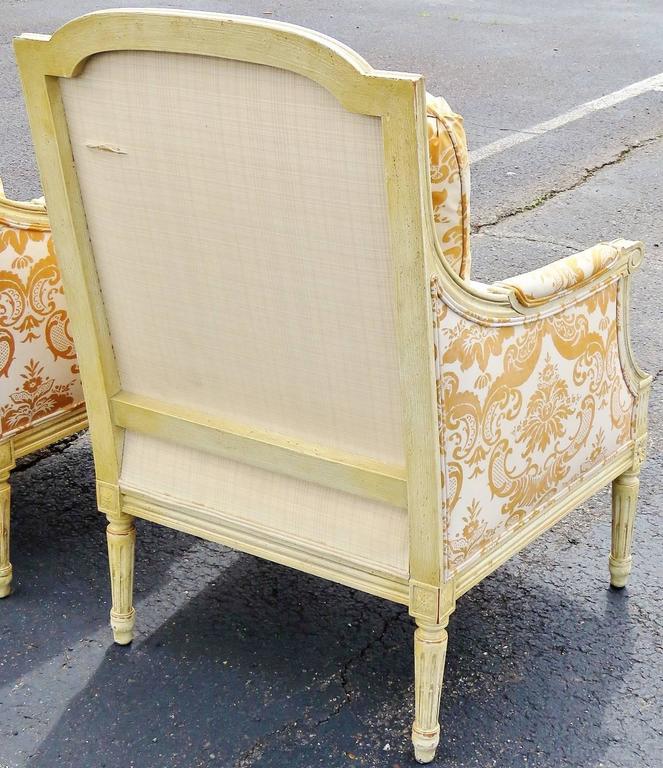 Pair of Distressed Cream Painted Carved Bergeres For Sale at 1stDibs