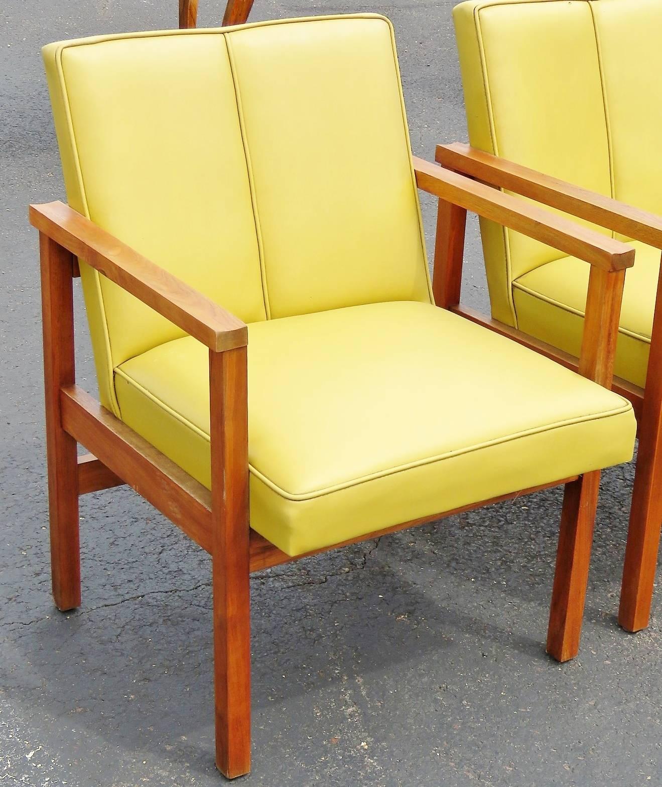 Pair of Danish lounge chairs. Walnut frames. Yellow Naugahyde upholstery.