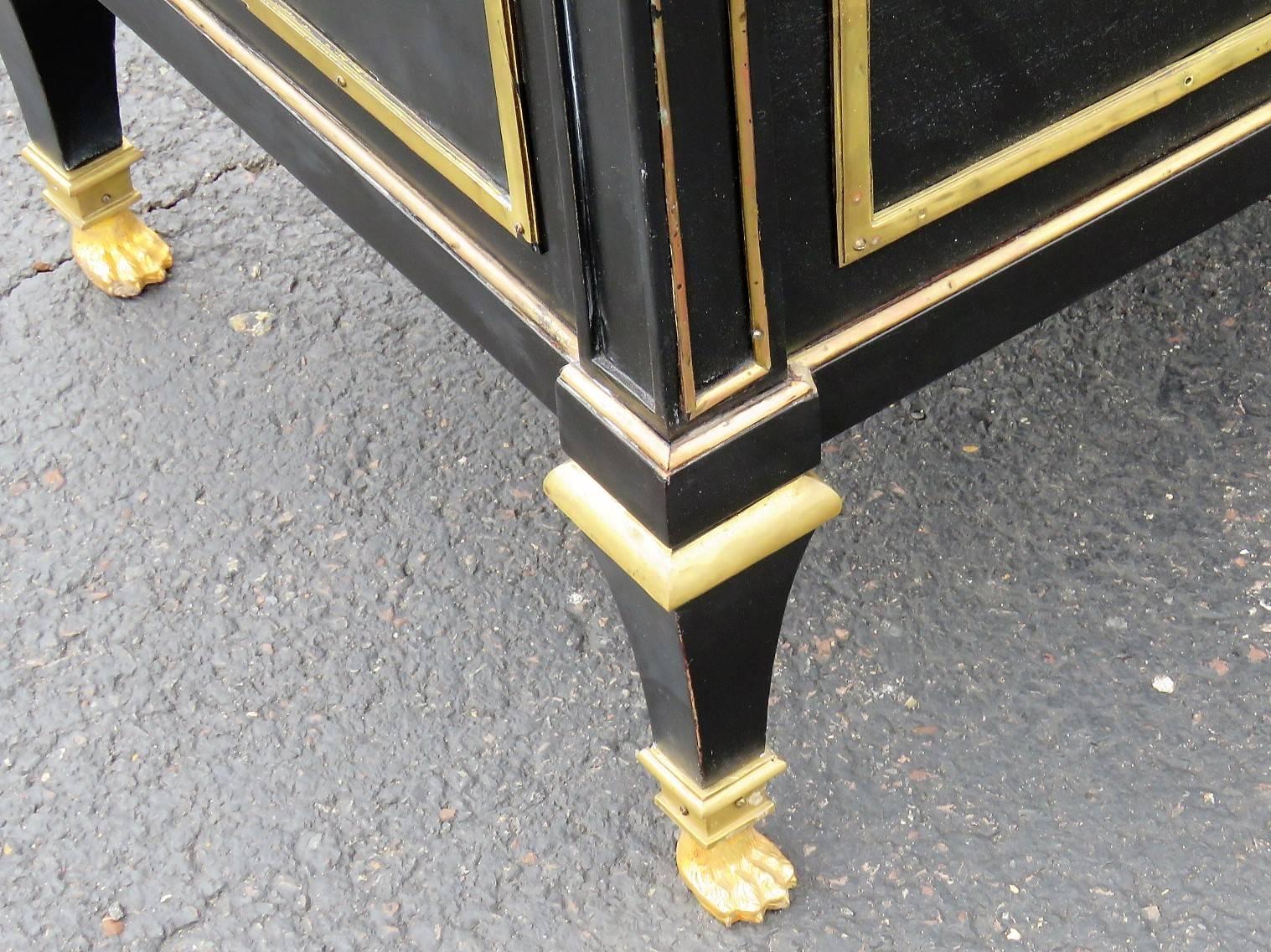 Ebonized painted frame with brass mounts and hardware. Marble-top.