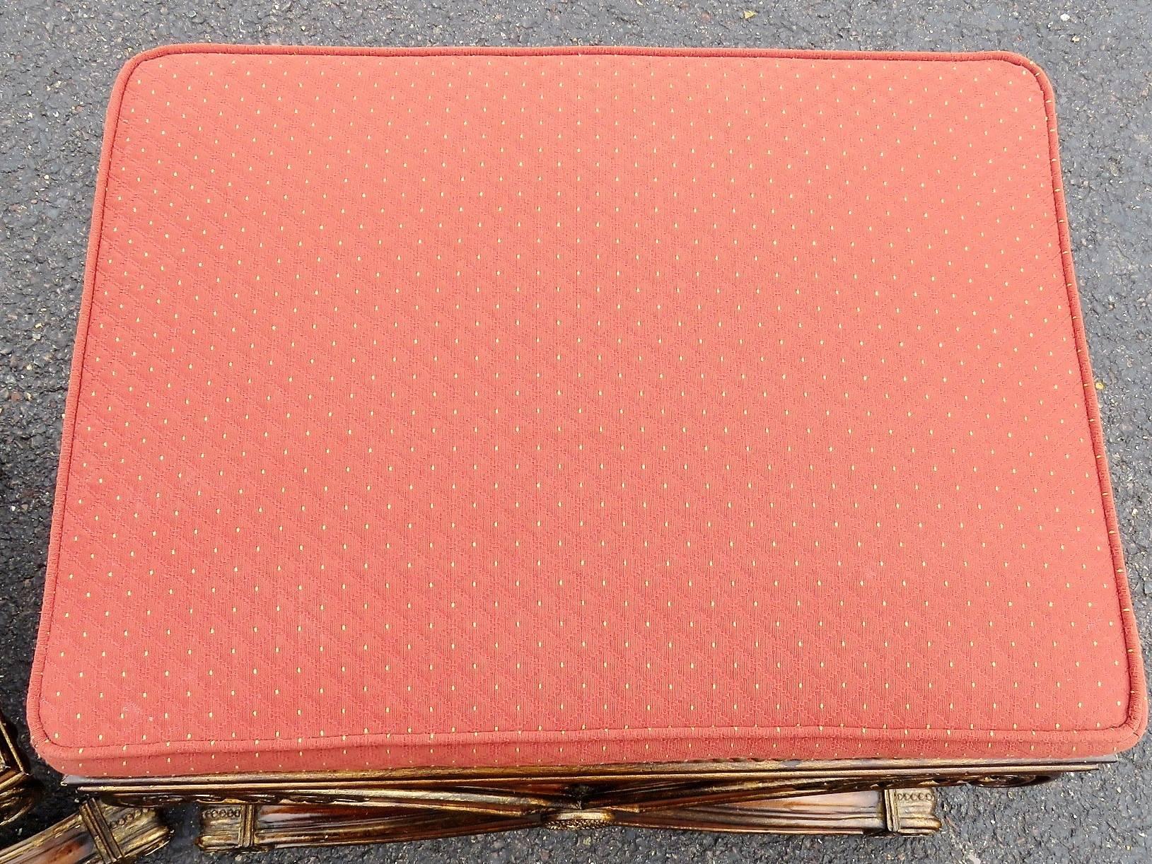 Red upholstered seats. Gilt carved X-bases with rosettes and plumes.