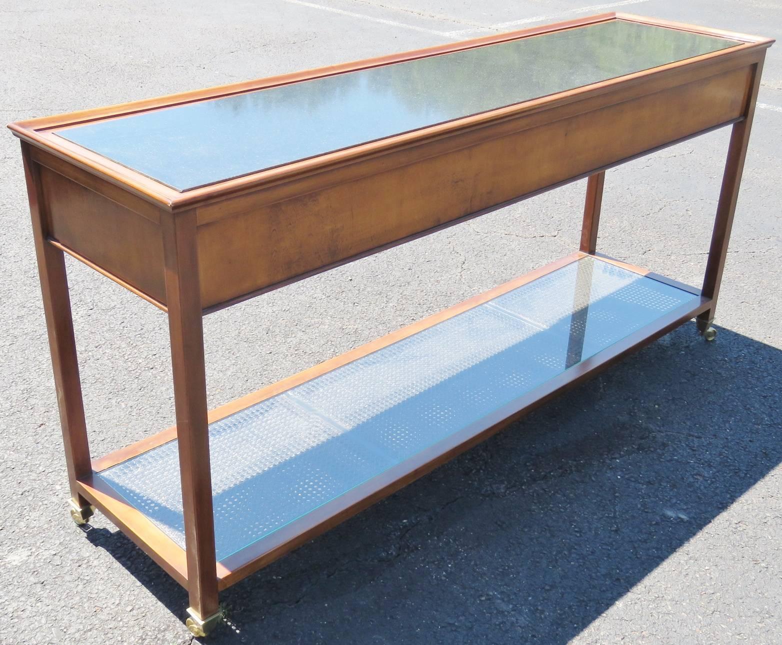 Marble top. Caned lower shelf with glass top.