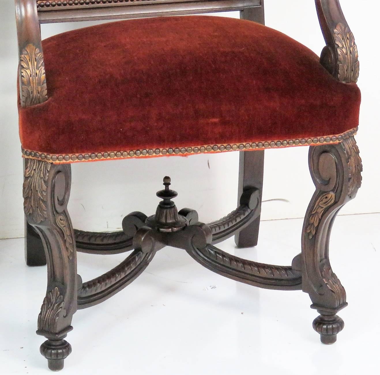 Red velvet upholstery. Heavily carved frame. Gilt highlights.