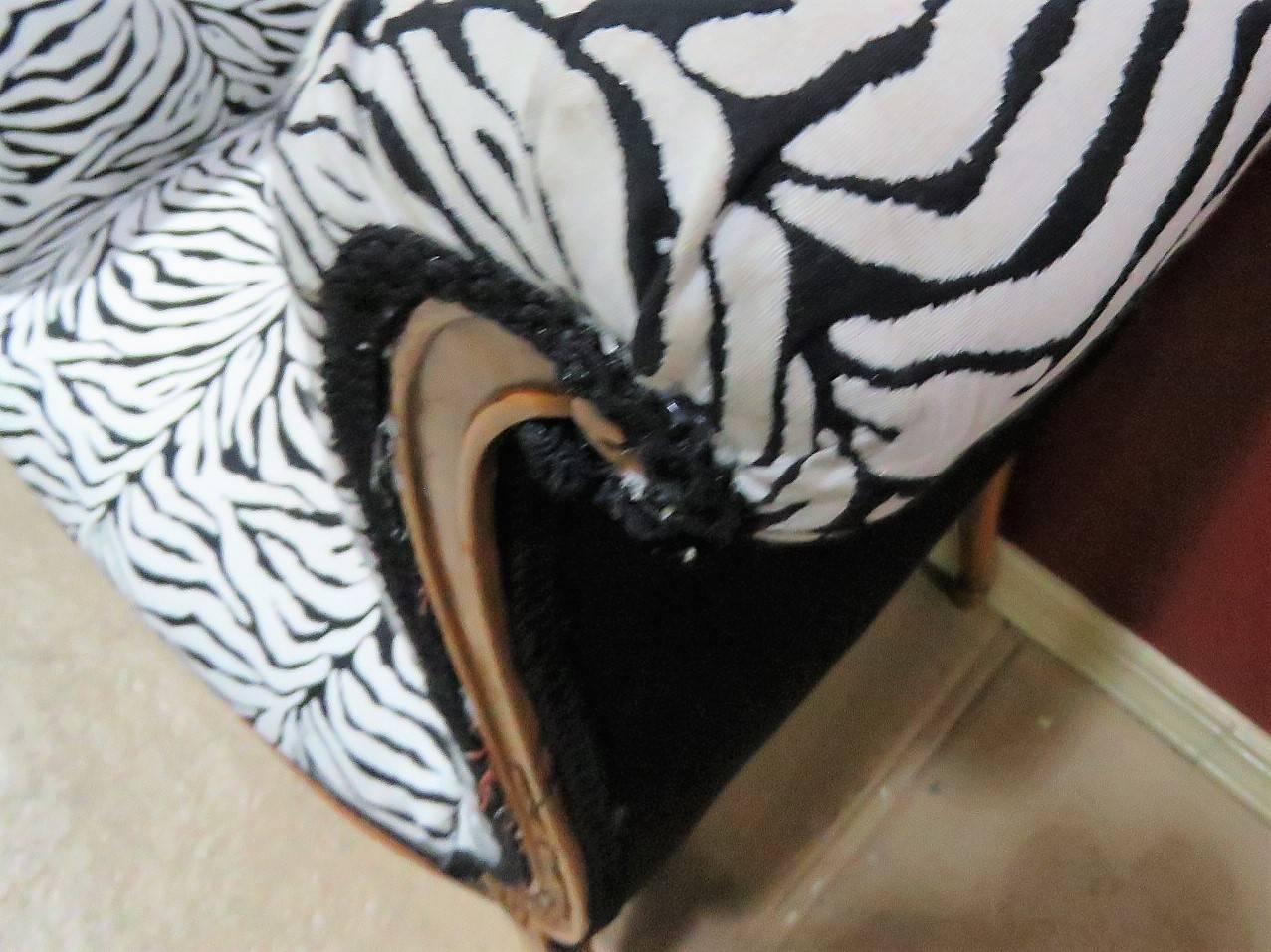 Zebra print upholstery carved bases.