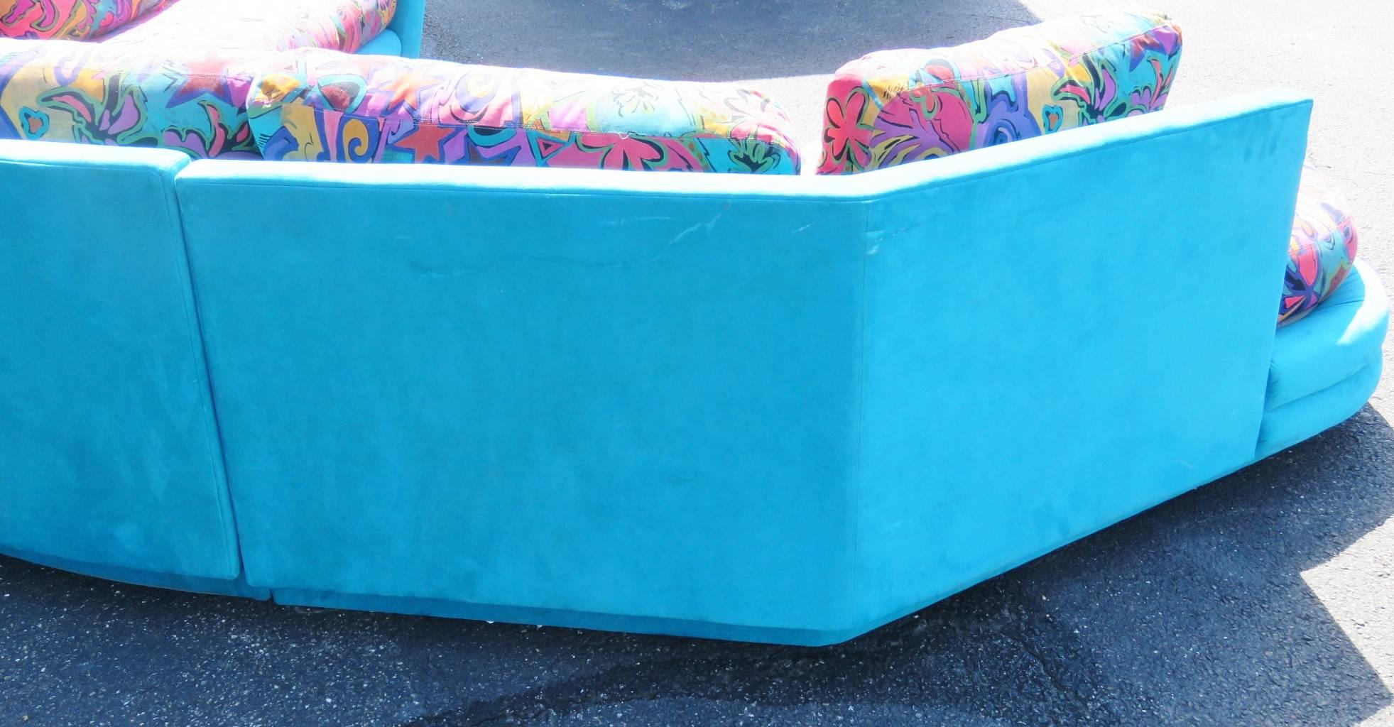 Turquoise microfiber frame. Modern decorative cushions. Directional tag.