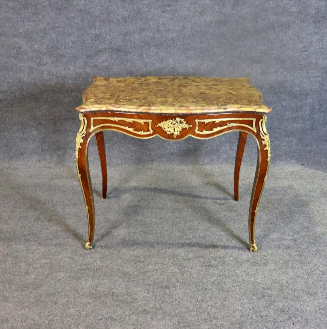 Linke Style Center Table with marble top and bronze mounts.  Dates to the late 19th century.


Marble top. Bronze mounts. 30 3/4