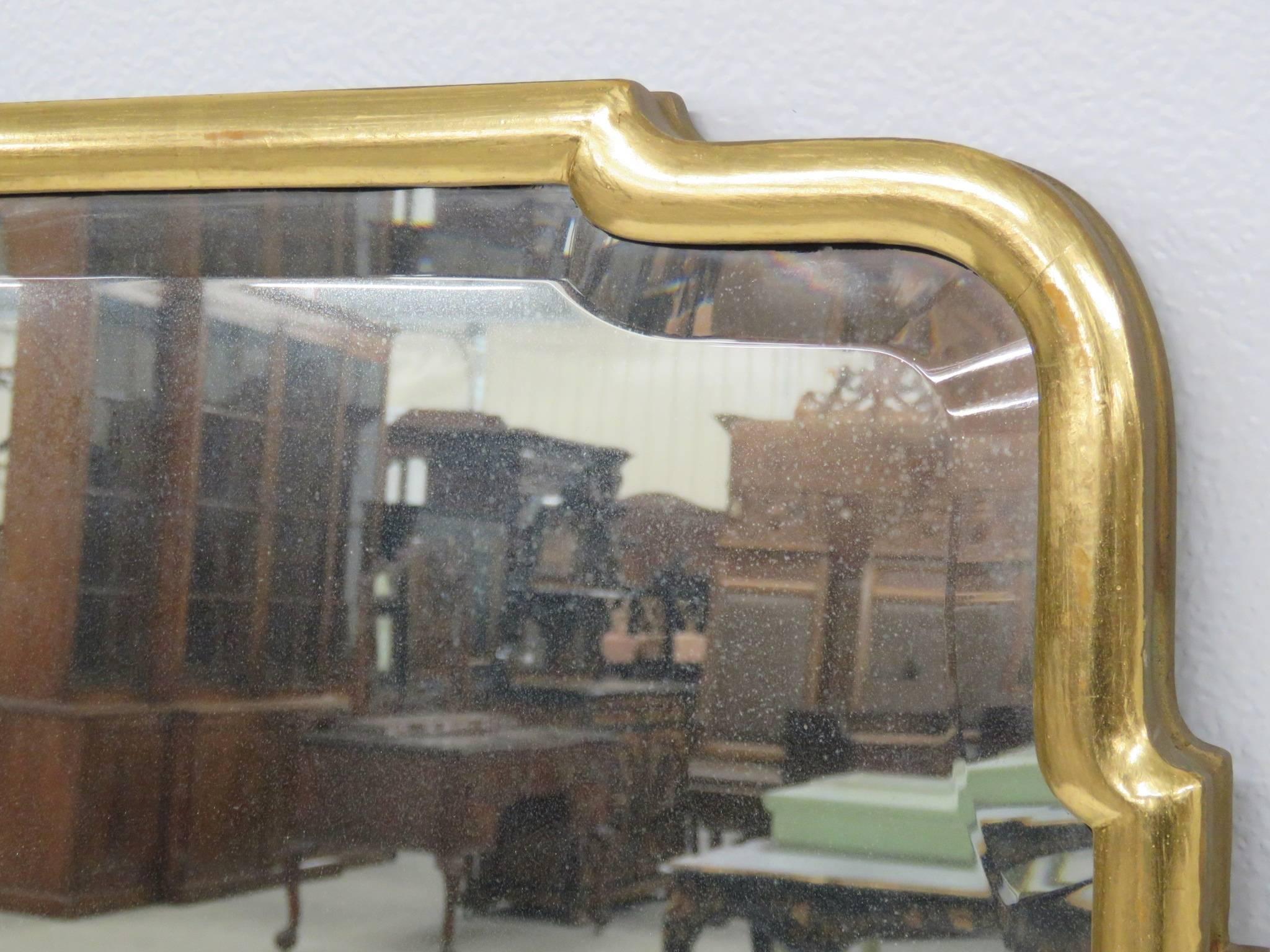 Mirrors have gilt frames with beveled split glass mirrors.