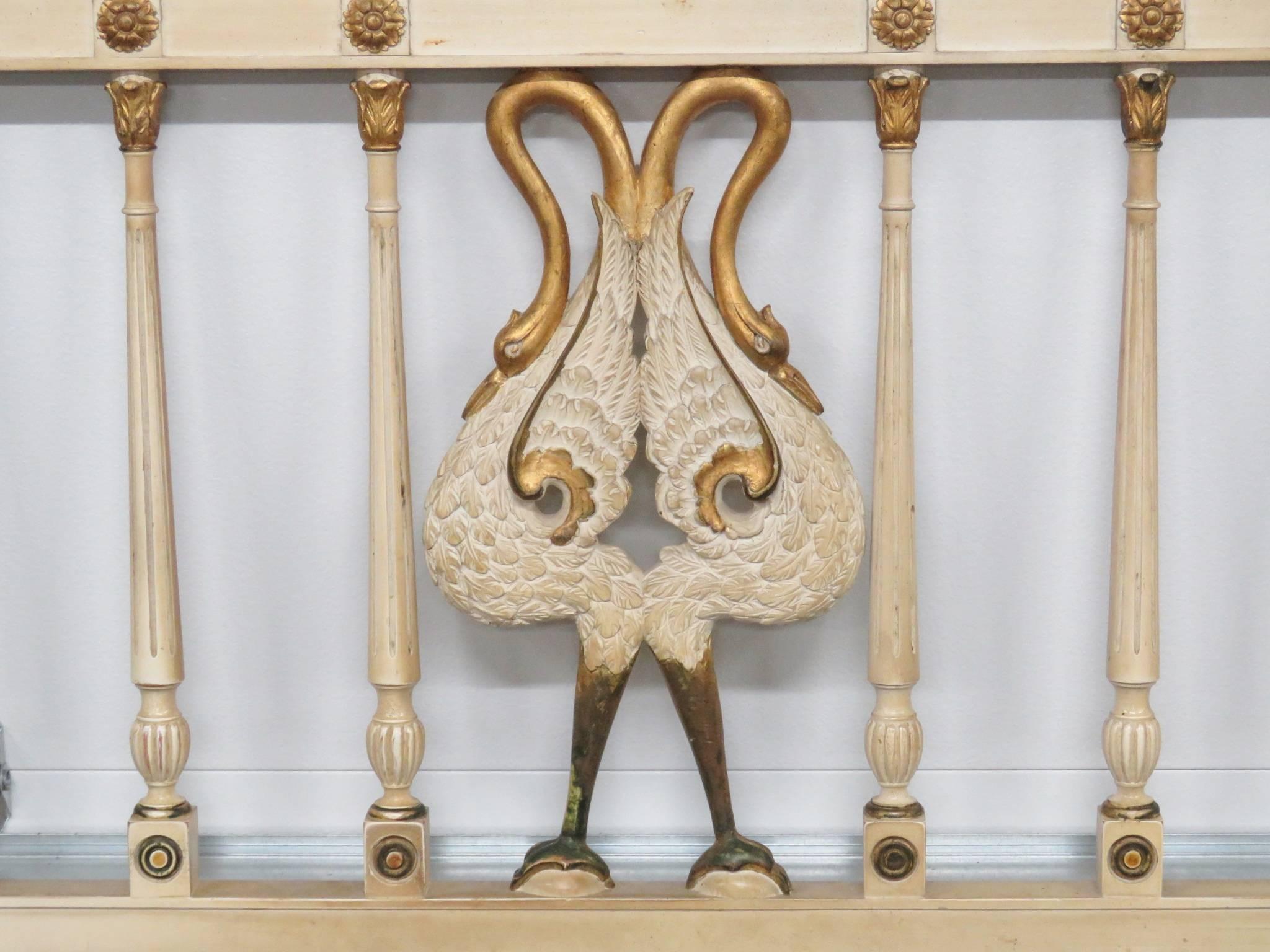 Headboard is cream painted with gilt highlights and swans.