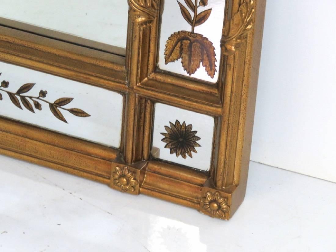 Mirror has silver and gold gilt églomisé panels, 60