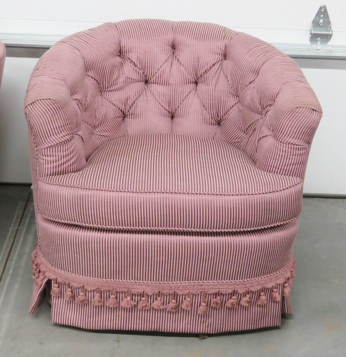 Purple striped tufted upholstery with swivel bases.