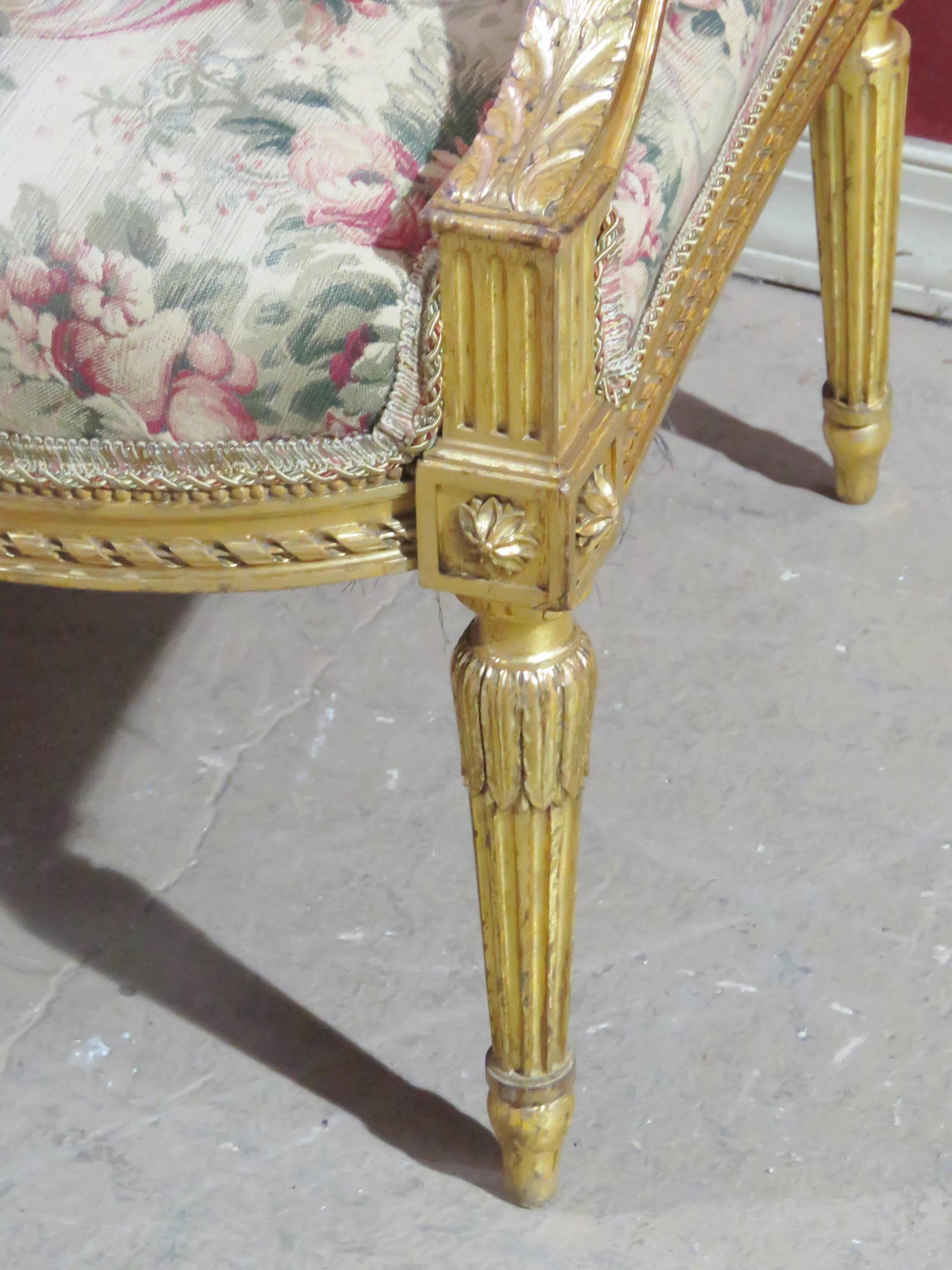 Carved gilt painted frames. Floral upholstery.