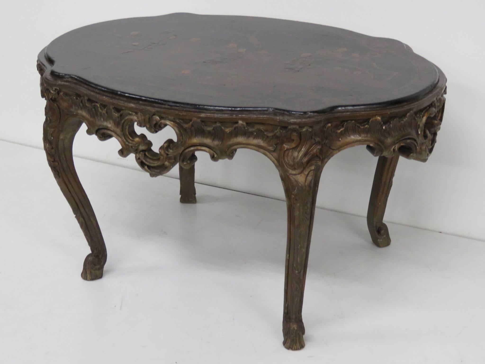 Chinoiserie decorated top with carved base.